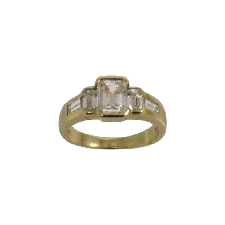 18 Karat Yellow Gold Emerald Cut Diamond Ring For Sale at 1stDibs