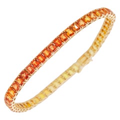 Bracelet tennis en or jaune 18 carats avec saphirs jaunes de taille émeraude