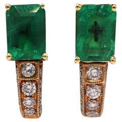 18 Karat Yellow Gold Emerald 
Diamond Dangle Drop Earrings