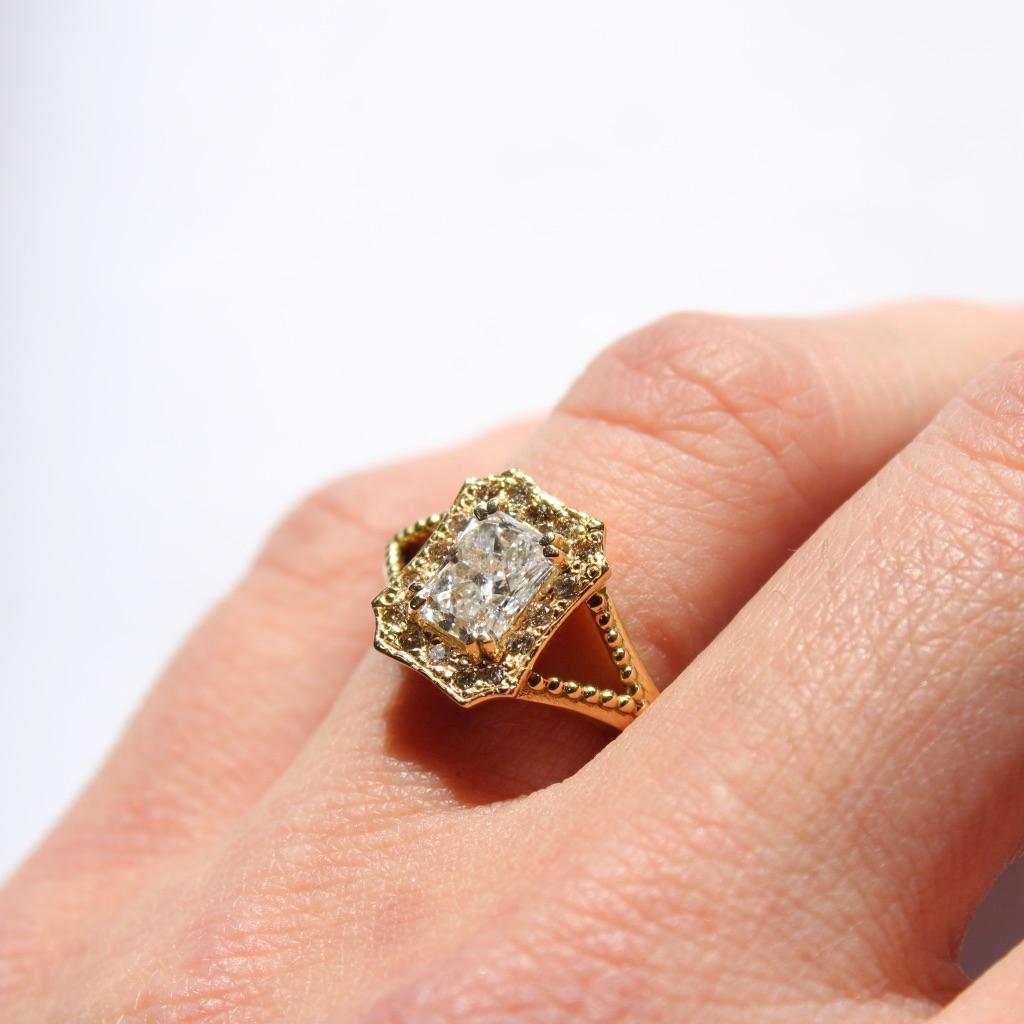 Artist 18 Karat Yellow Gold Emerald Halo Diamond Ring For Sale
