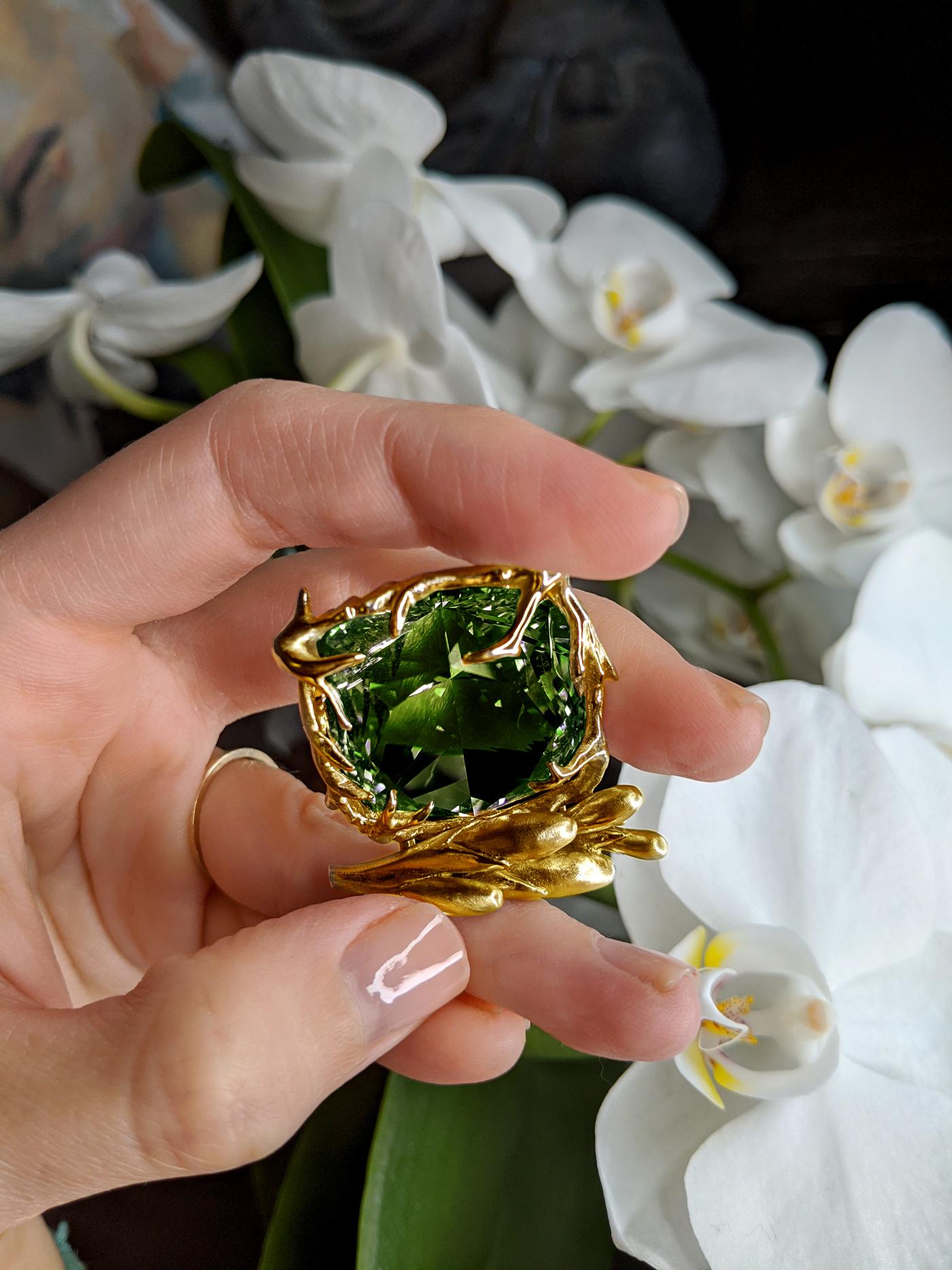 The center of this Fairy Tale ring is a beautiful grown emerald set in 18 karat yellow gold. The length of the piece is 2.7 cm, and it is designed by the talented oil painter, Polya Medvedeva. Her mission is to create unique pieces that stand out
