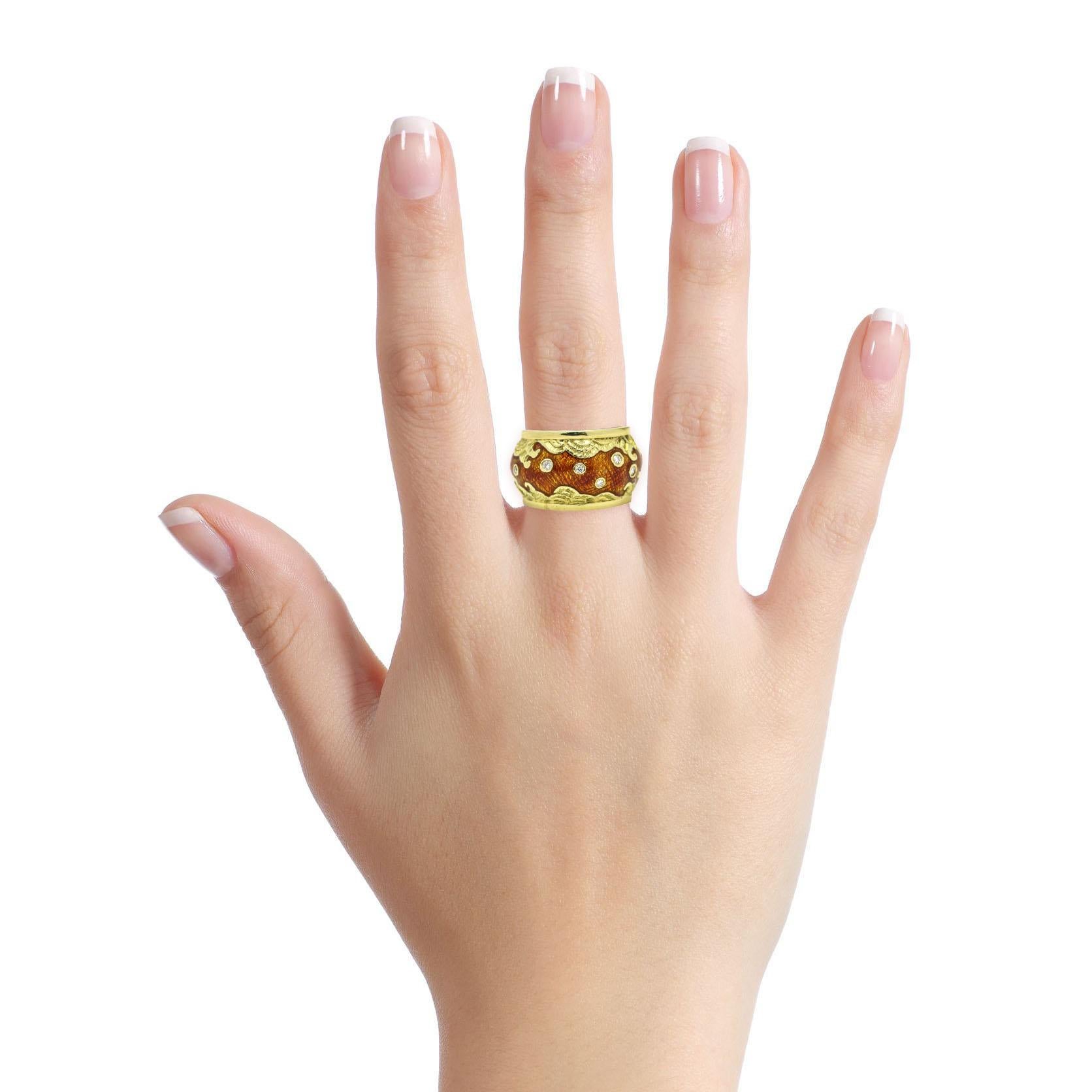 D shaped wide band ring in 18-karat yellow gold with diamonds and enamel. Textured gold wave design with orange enamel detail, and bezel set diamonds.

Size, 6
Diamond Total Carat Weight, .25 carat
