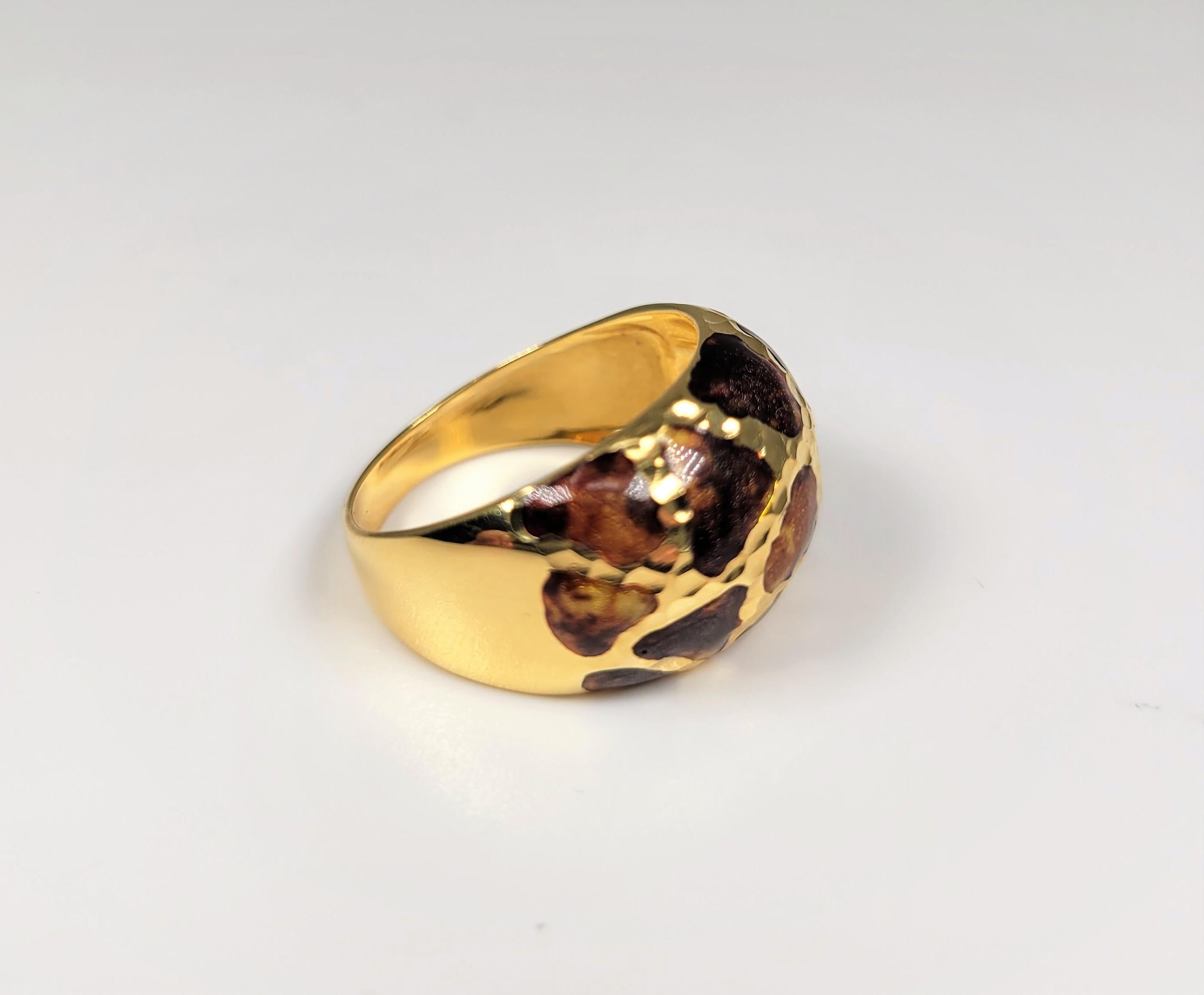 The enamel is in glittering shades of brown on this 18 karat yellow gold ring.  