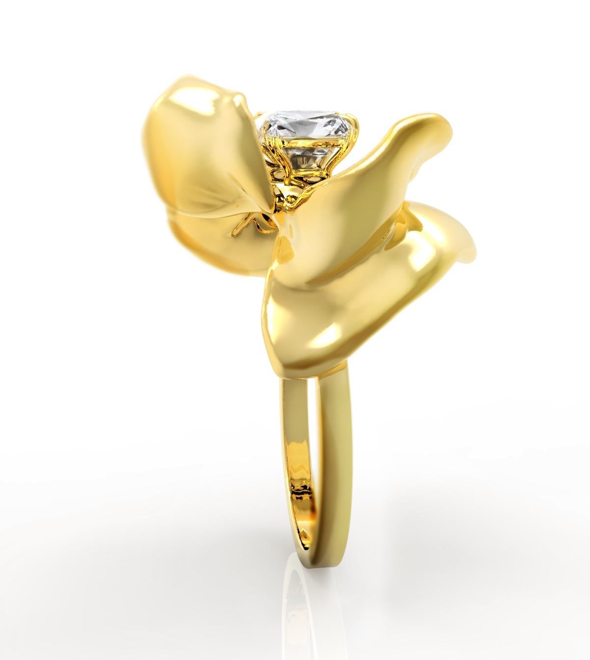 This 18 karat yellow gold Magnolia Flower engagement ring features a big cushion diamond with excellent characteristics. The placement of the diamond in the yellow gold setting resembles a firebird in this shape, complementing the sparkle of the