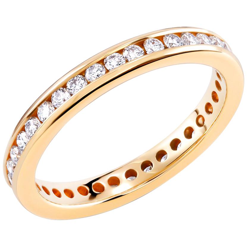 18 karat yellow gold channel-set 2.75 millimeter diamond wedding band 
Diamond weighing 0.80 carat 
New ring 
Diamond quality G VS
Ring size 5 In Stock
Ring cannot be sized
