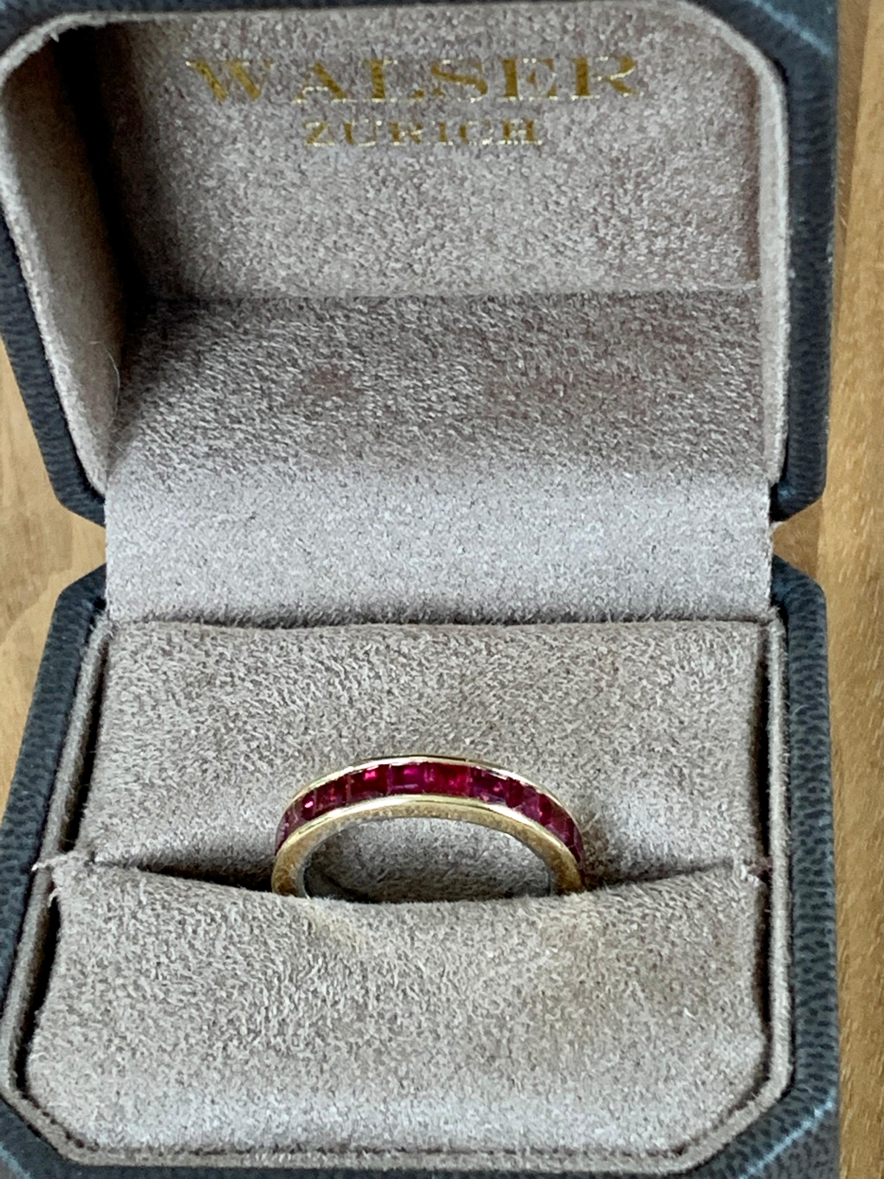 18 K yellow Gold Ruby eternity ring. The 18 square cut rubies weighting 4.68 ct are set in a solid channel setting. 
Ring fits a ring size 56/16 ( US size 8) and can only be resized to a certain extent. 
This type of rings are particularily  nice