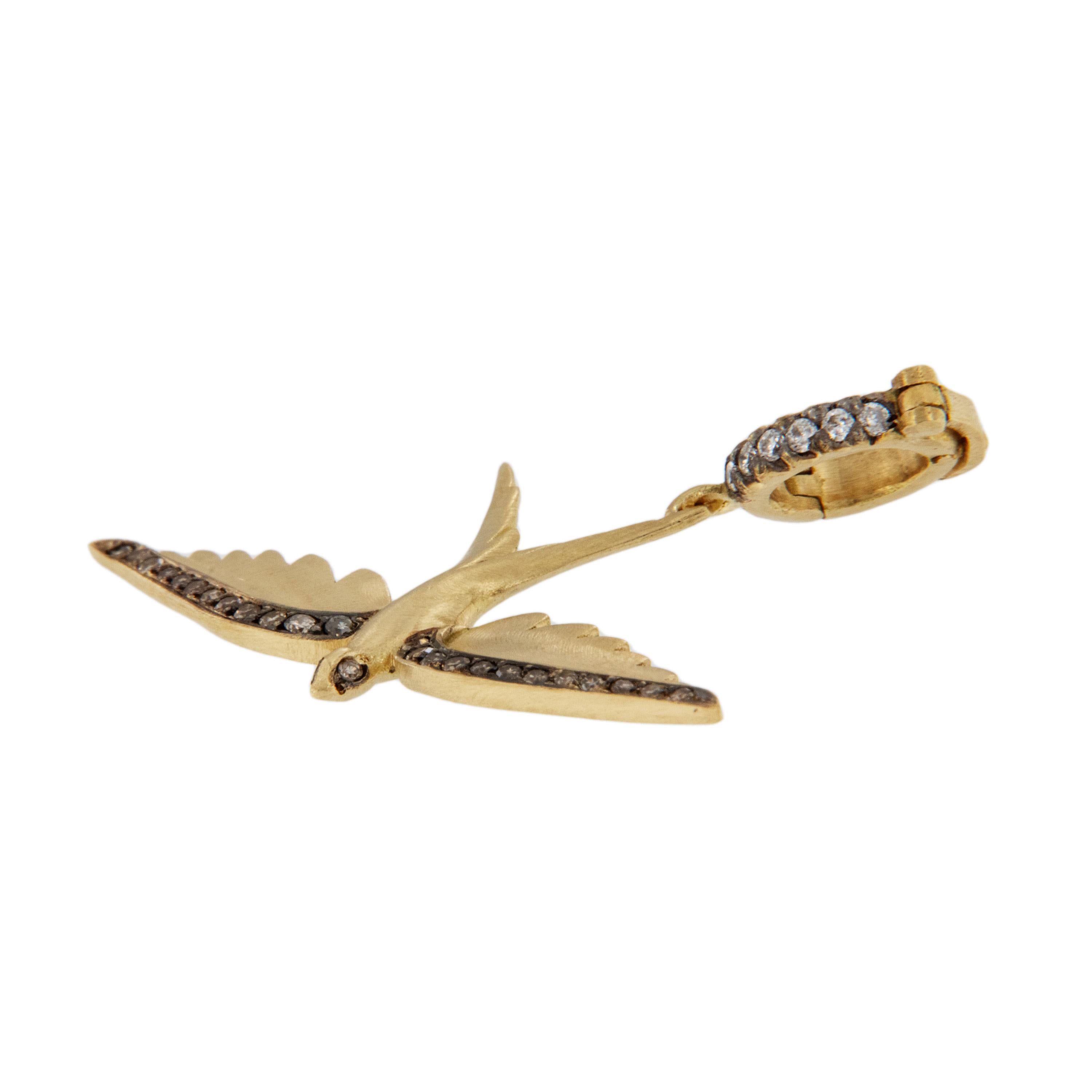 Crafted in rich 18 karat yellow gold this elegant swallowtail bird is edged with 0.11 Cttw Fancy Brown diamonds accented with black rhodium for a striking look! White diamonds accent the bail which is hinged making it easy to wear with your favorite