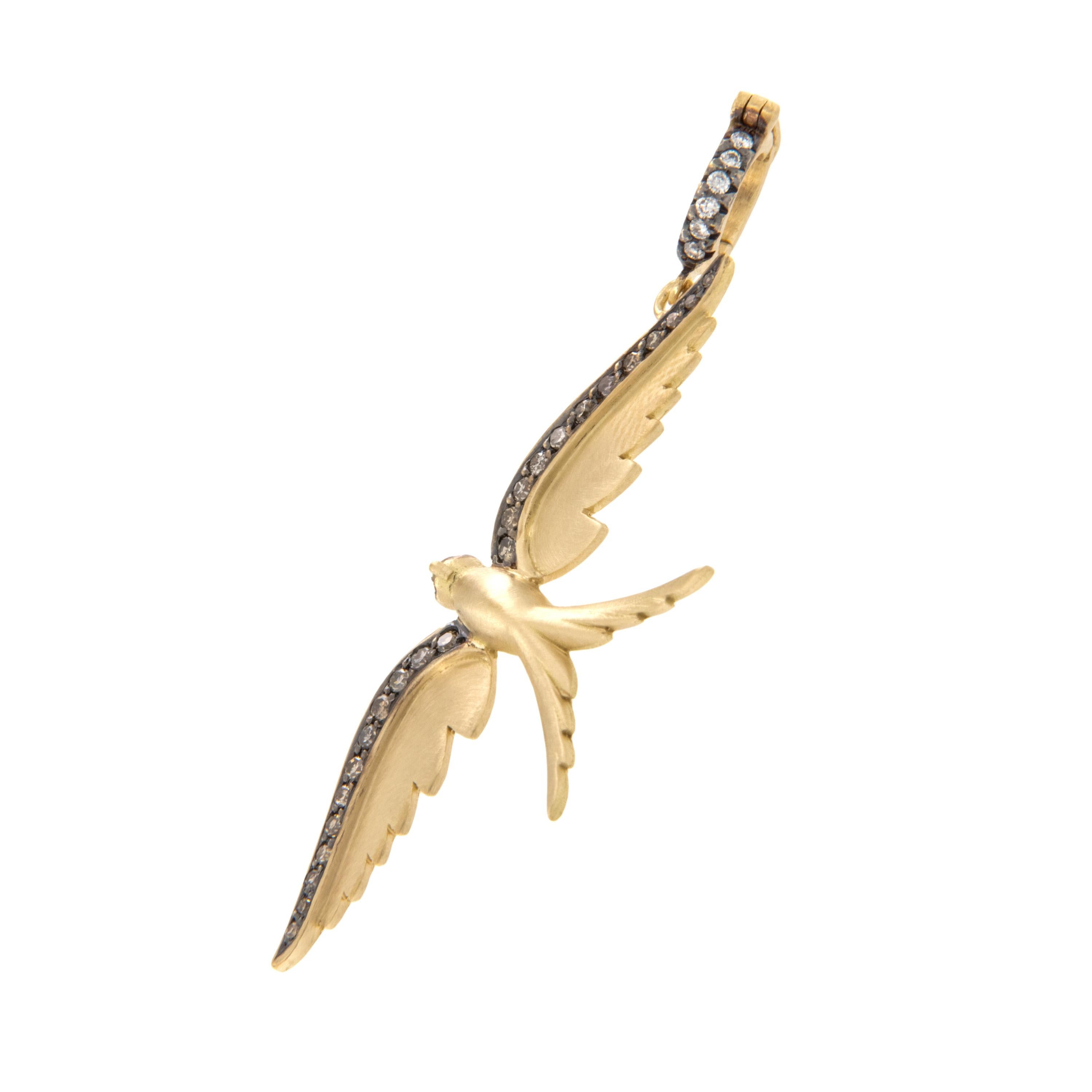Crafted in rich 18 karat yellow gold this elegant swallowtail bird is edged with 0.19 Cttw Fancy Brown diamonds accented with black rhodium for a striking look! White diamonds = 0.04 Cttw. accent the bail which is hinged making it easy to wear with