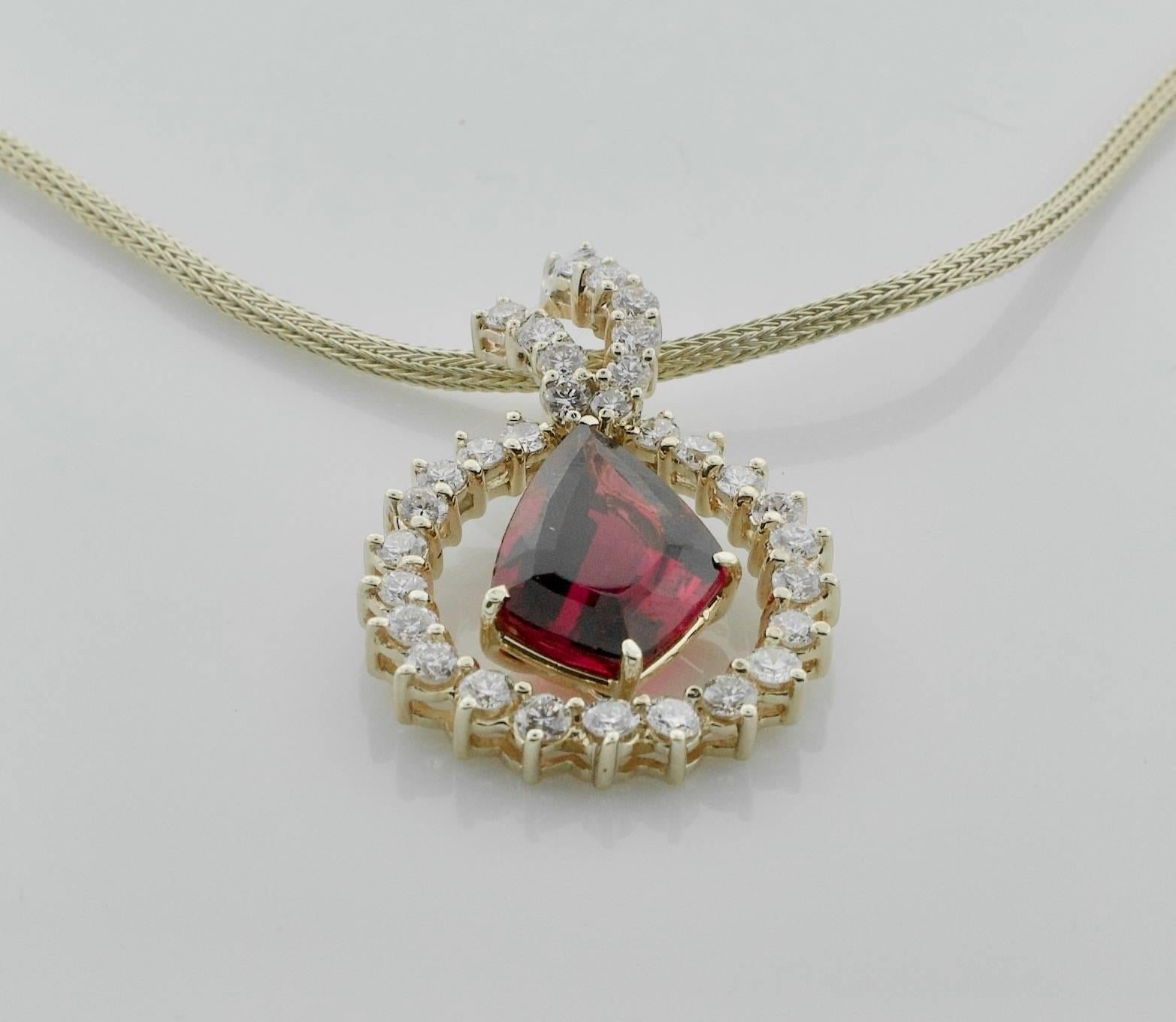 18k Yellow Gold Fancy Shaped Tourmaline and Diamond Freeform Necklace 
One Fancy Cut  Tourmaline weighing 7.50 carats approximately [bright with no imperfections visible to the naked eye]
A One of a Kind Shape
Thirty One Round Brilliant Cut Diamonds