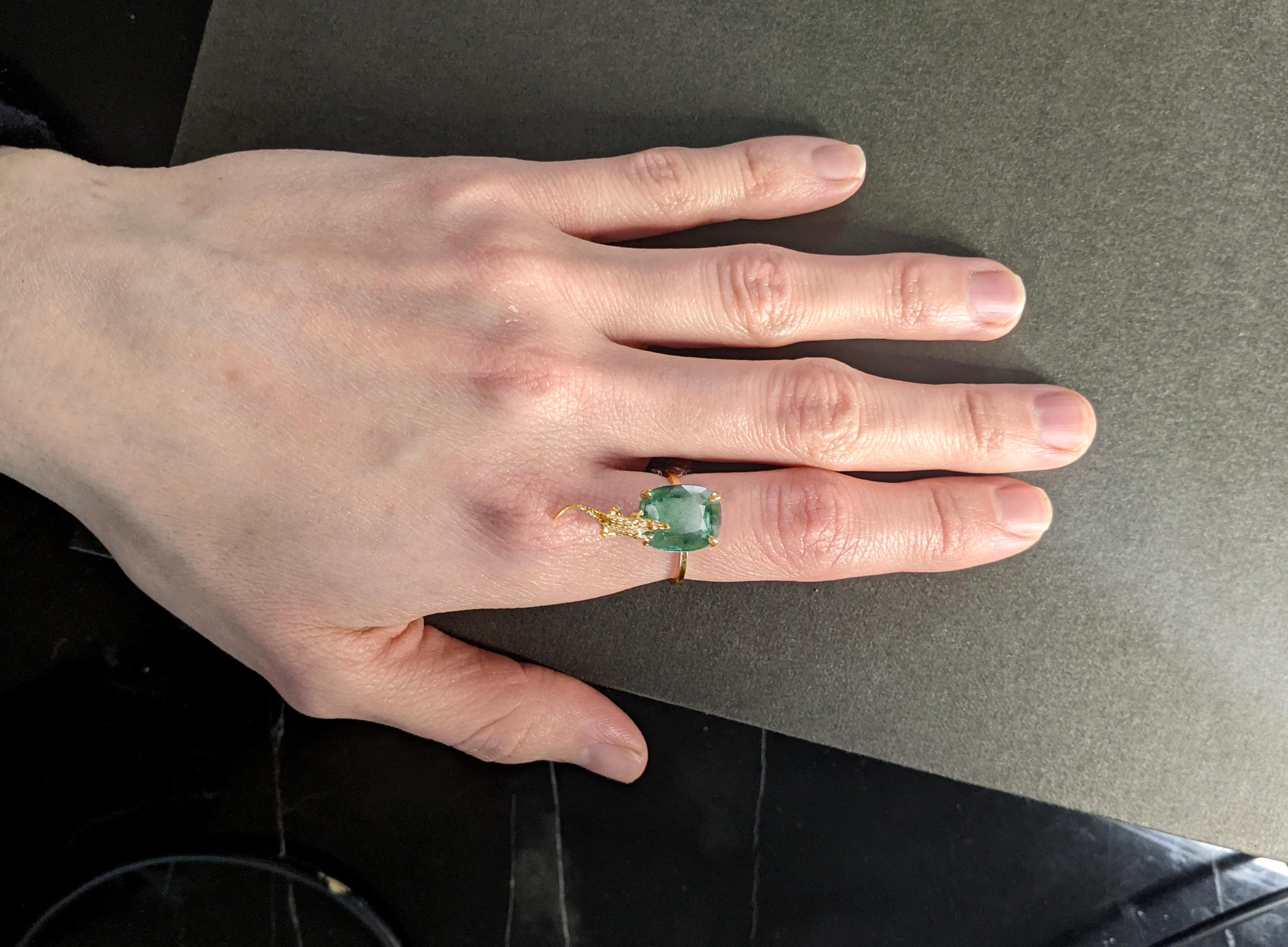 This 18 karat yellow gold Mesopotamian engagement ring is encrusted with 3.48 carats natural cushion cut emerald, cold tone, 10.5x9 mm. 

You can order this piece in white, rose or yellow gold, with spinel, sapphire, emerald, tourmaline or the other
