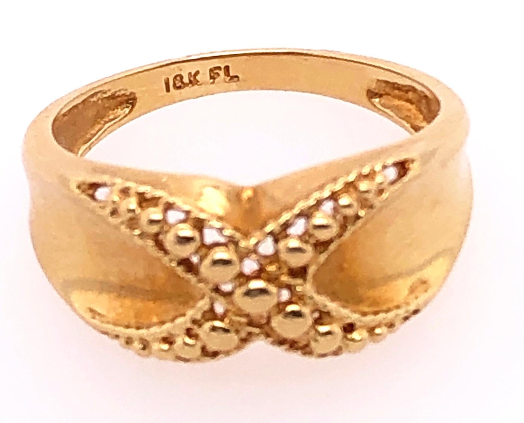 18 Karat Yellow Gold Fashion Ring.
Size 8
4.25 grams total weight.