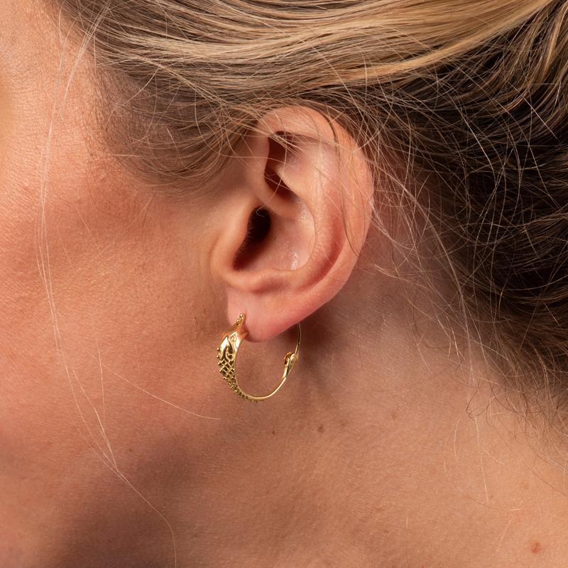 These unique 18 karat yellow gold earrings feature a fish motif for a special touch. 
Measurements: Inner diameter approximately 15.30mm
Condition: Excellent. No visible signs of wear. 