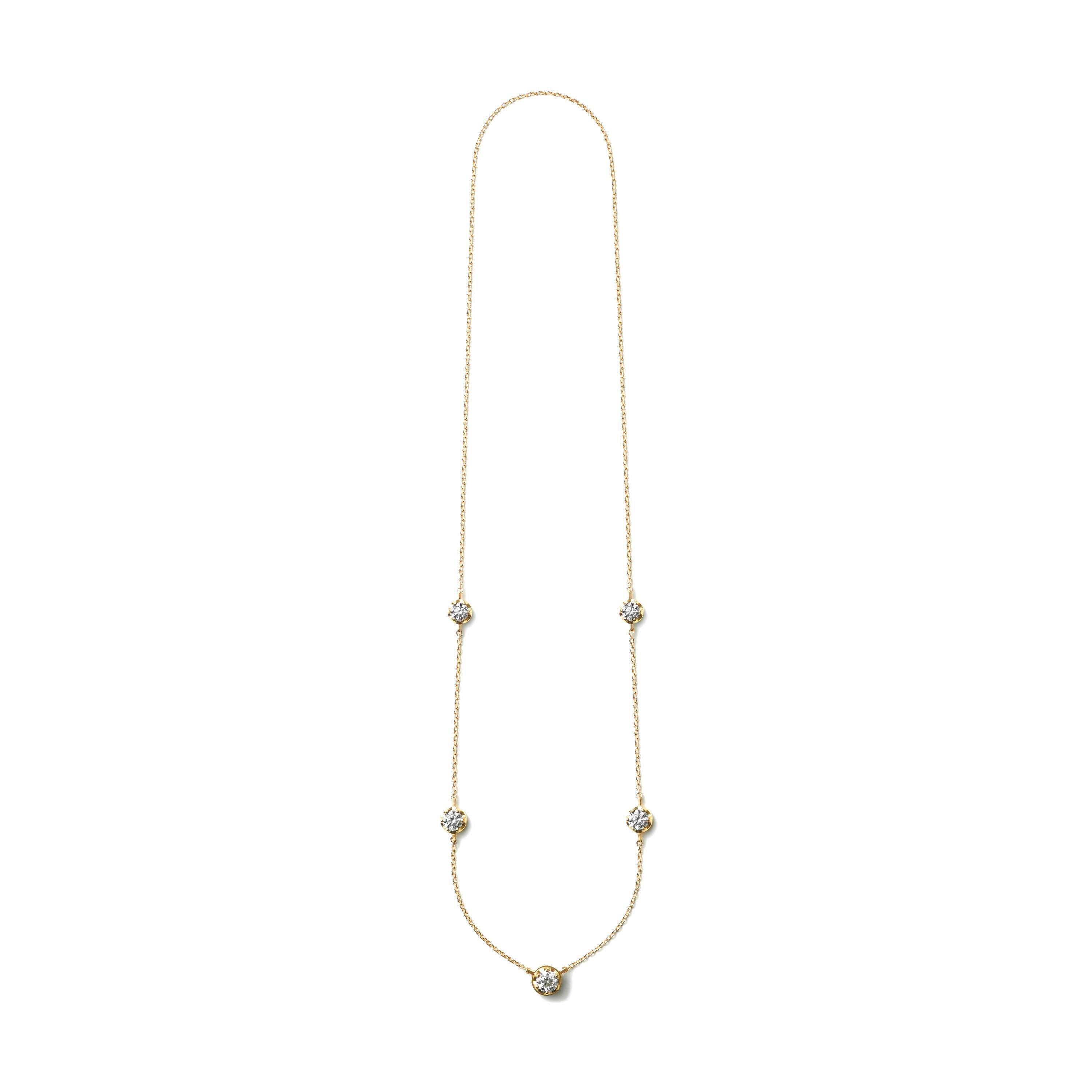 A necklace featuring five graduating sizes of diamonds. The bottom diamond setting doubles as a hidden clasp. Turn it horizontally 45 degrees to open and close. Available in 3 other varieties.

18 Karat Yellow Gold Five-Stone Diamond Necklace
Chain