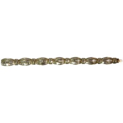Bracciale flessibile in oro giallo 18 carati con diamanti baguette