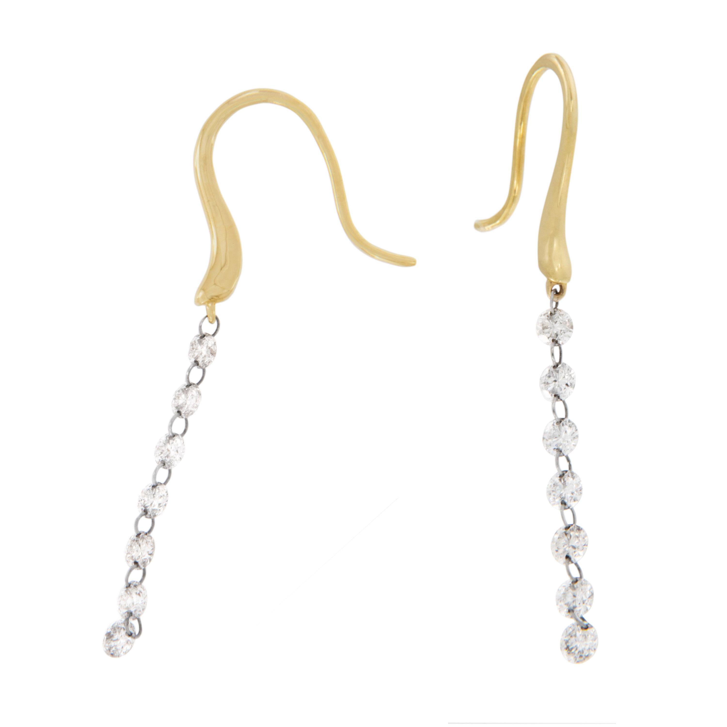So fun and contemporary! These 18 karat yellow gold dangle diamond earrings contain 14 