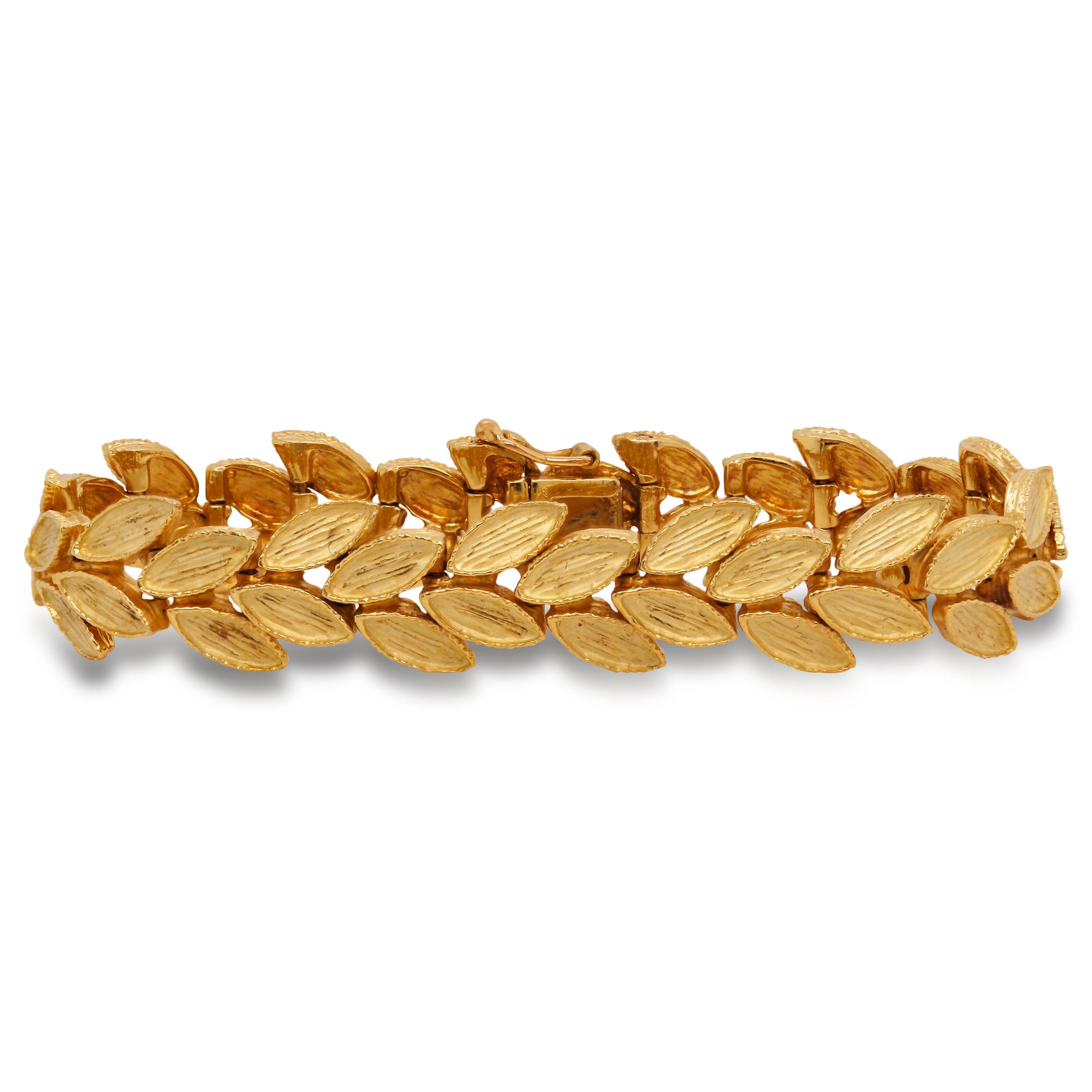 18 Karat Yellow Gold Floral Motif Leaves French Bracelet

The intricate attention to detail on this bracelet are remarkable and showcase the true beauty of hand made work. The leaves are all done in a brushed, matte-finished 18 karat yellow
