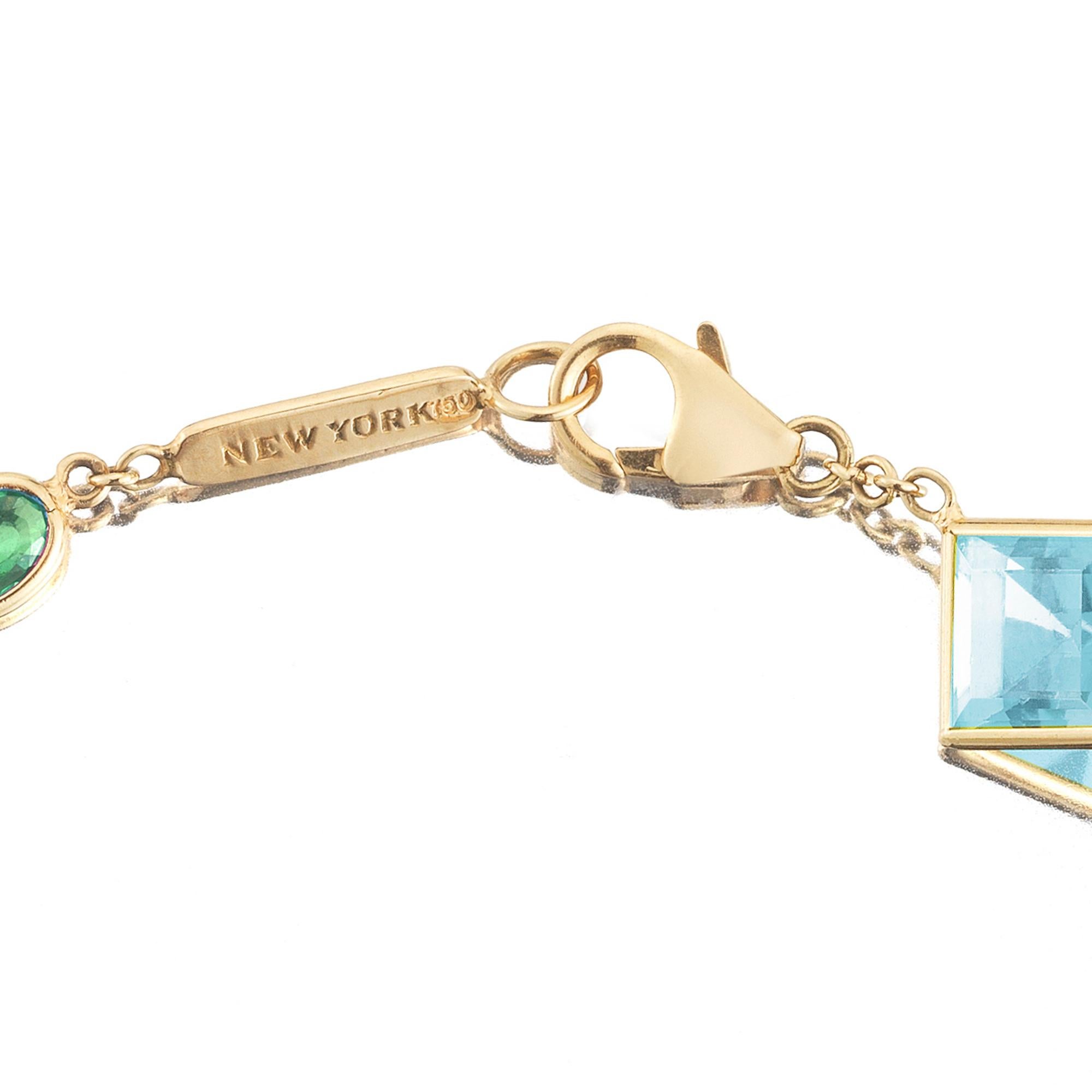 18kt yellow gold Florentine station bracelet with bezel set emerald-cut blue topaz and round tsavorite garnets, and signature Brillante® motif.

Inspired by the Garden of the Iris, the Florentine collection pairs bold color combinations of geometric