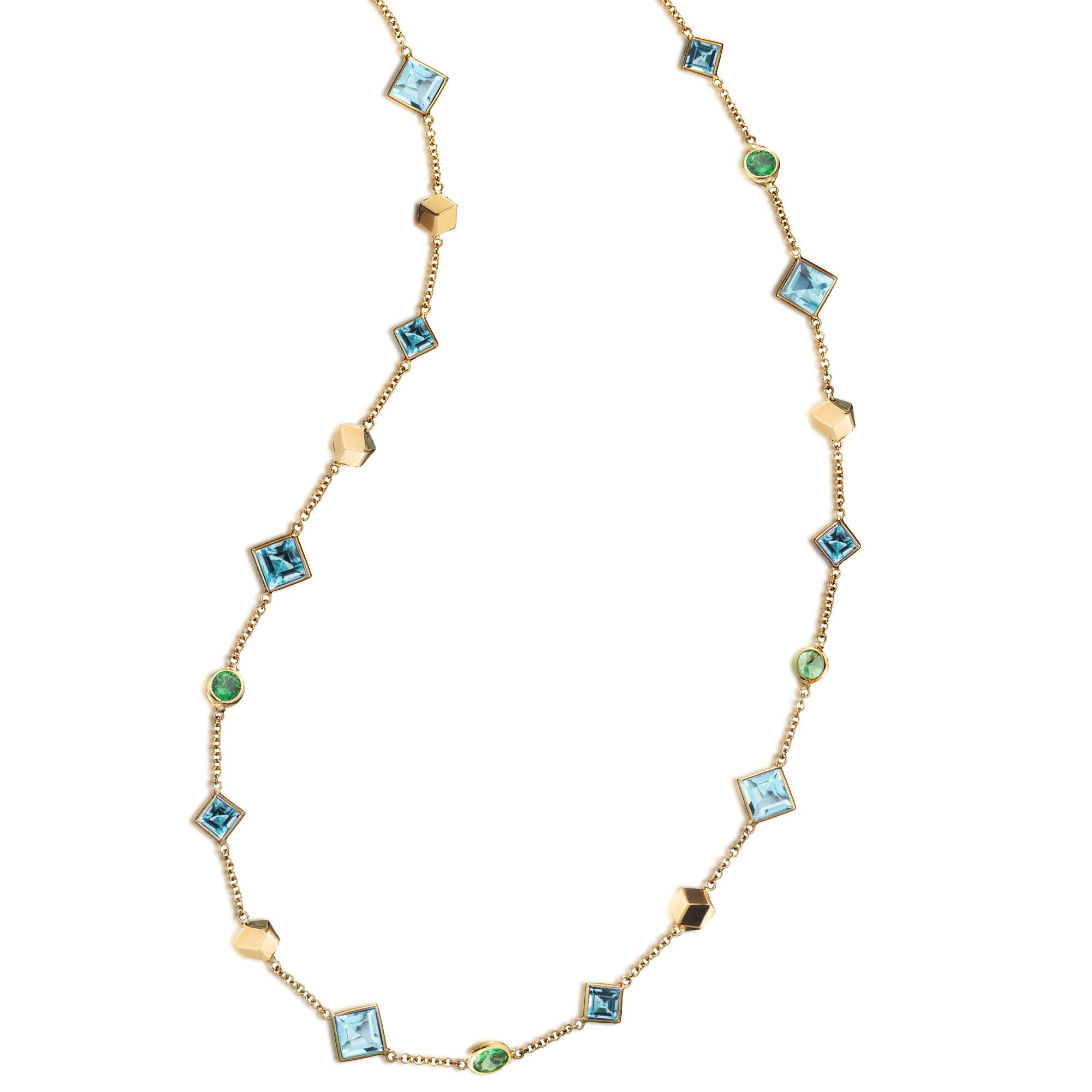 18kt yellow gold Florentine sautoir necklace with bezel set emerald-cut blue topaz and oval tsavorite garnets, and signature Brillante® motif.

Inspired by the Garden of the Iris, the Florentine collection pairs bold color combinations of geometric