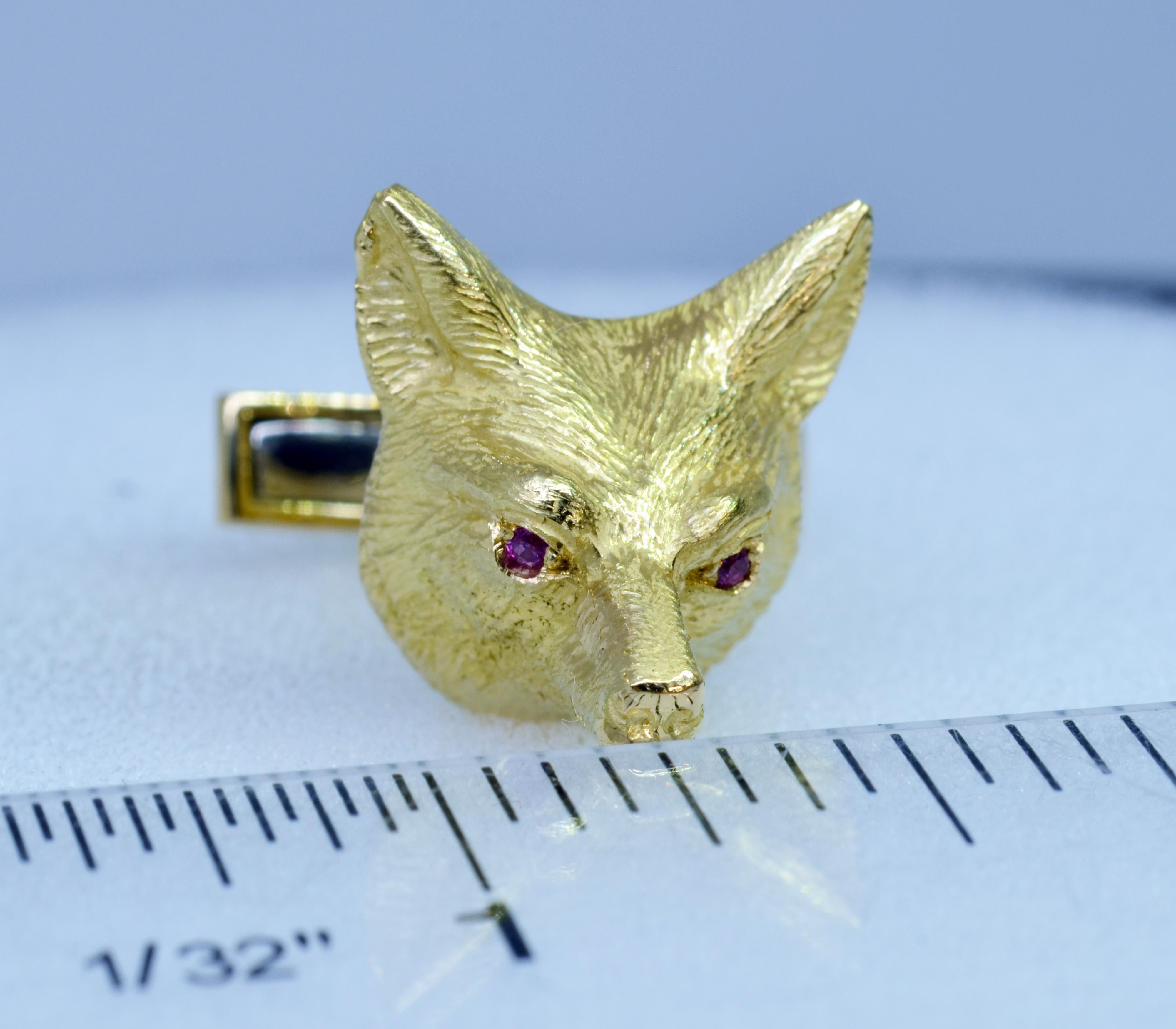 These handcrafted 18 Karat yellow gold Fox Mask cufflinks are set with vibrant pink Sapphire eyes and have custom spring lever backs. Classic Fox equestrian design.