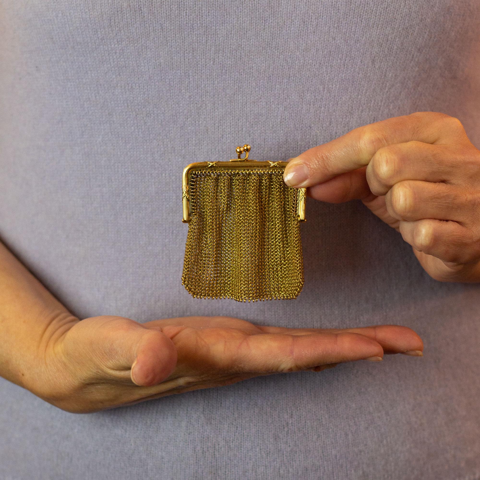 A fine 18 karat yellow gold French coin purse of small proportions. The purse has been entirely hand crafted with every link of the chainmail 'bag' hand made, joined and soldered together. The piece is double struck with what is likely the French