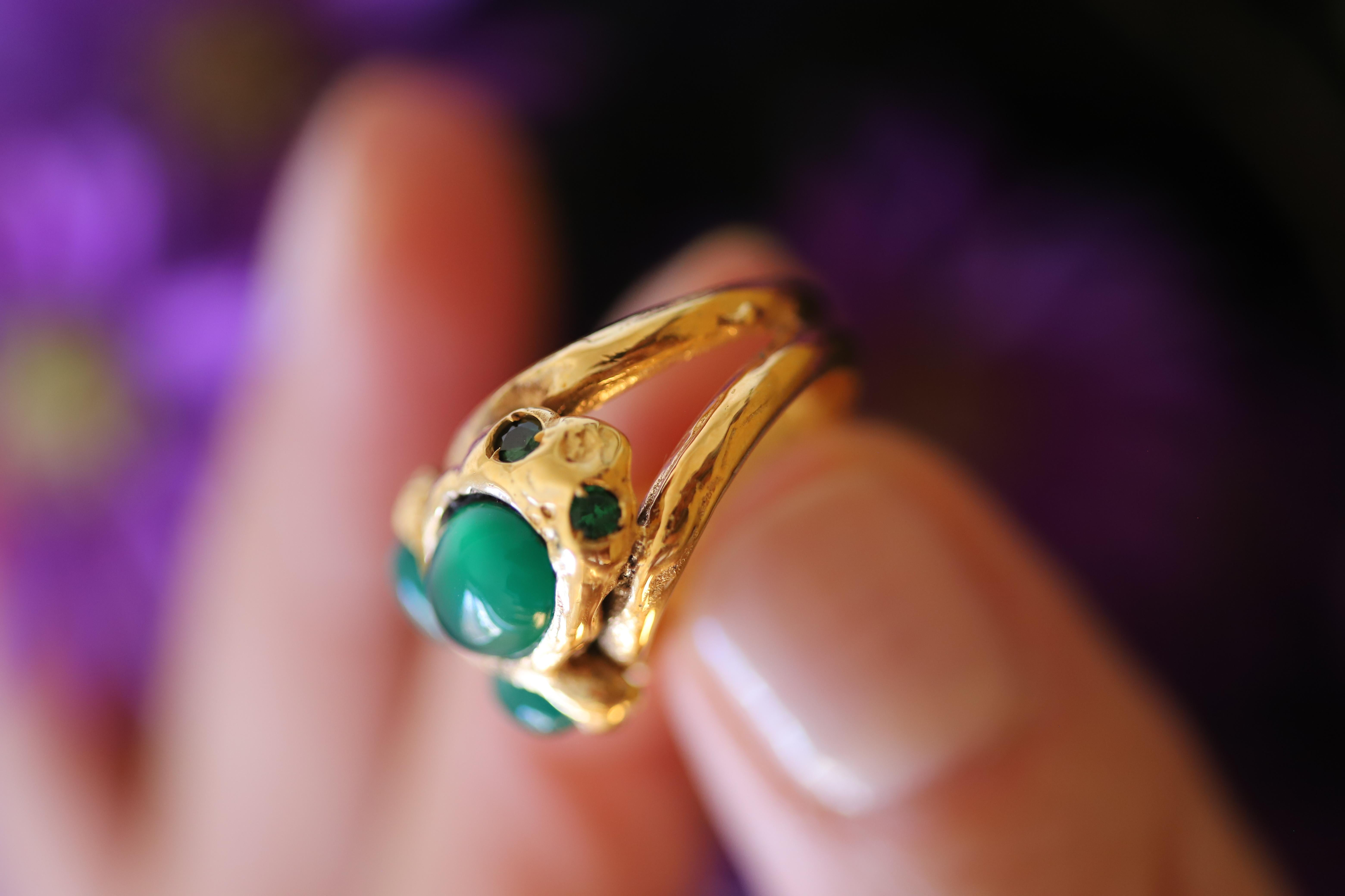 Rossella Ugolini Design Collection, surrealist Frog ring Handcrafted in 18 Karats Yellow Gold and cabochon oval cut Green Agate. The design of the ring reproduces a stylised surrealist Frog while jumping on the little finger towards infinity,