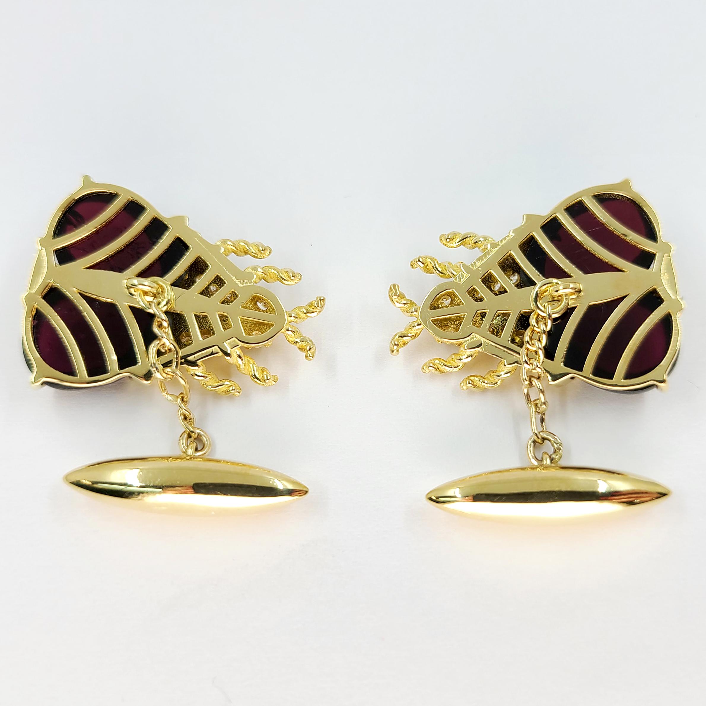 Beautifully Crafted 18 Karat Yellow Gold Beetle Cufflinks Featuring 4 Cabochon Garnets Weighing Approximately 10 Carats. 38 Round Brilliant Cut Diamonds of VS Clarity & G Color Total Approximately 1.50 Carats. Finished Weight is 26.3 Grams. Chain