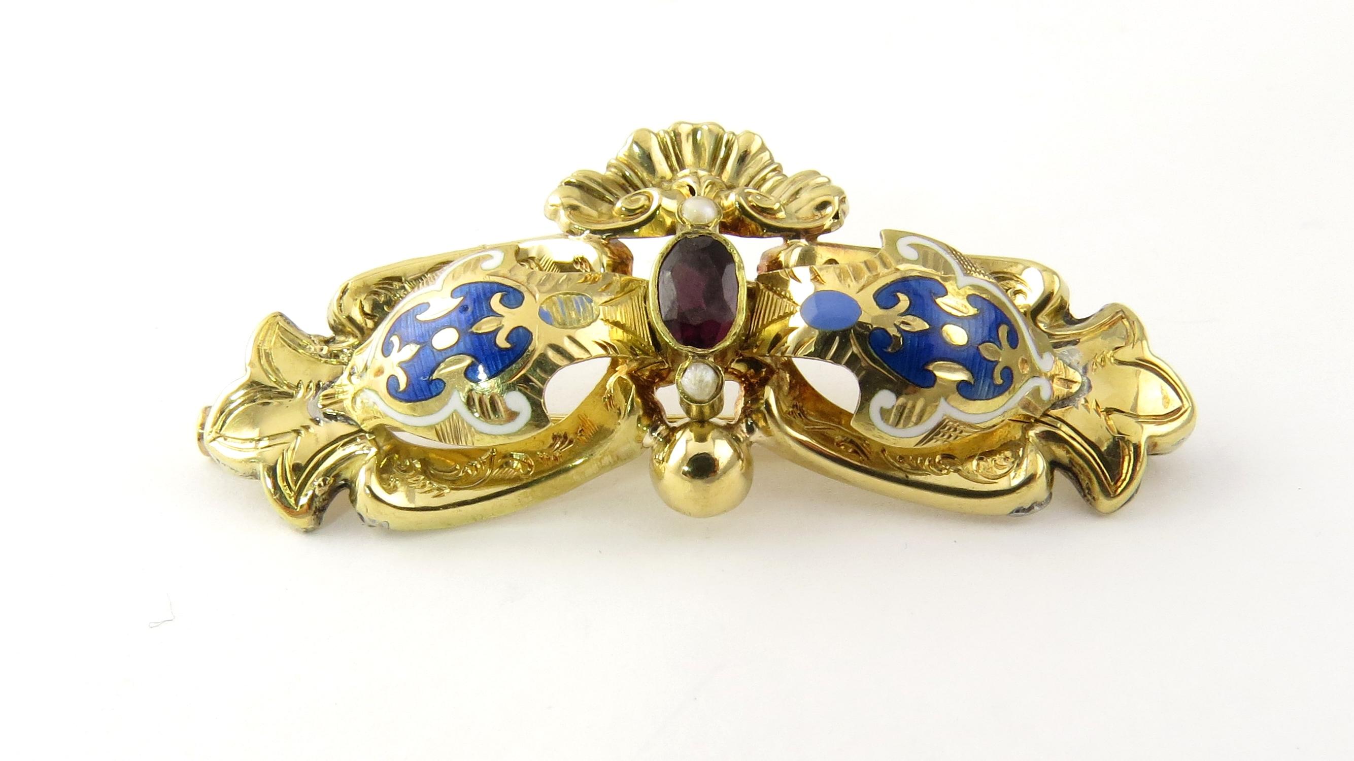 Vintage 18 Karat Yellow Gold, Garnet, Seed Pearl and Enamel Brooch / Pin

This stunning enameled brooch features one oval garnet (7 mm x 5 mm) two seed pearls beautifullly detailed in 18K yellow gold.

Size: 48 mm x 22 mm

Weight: 4.0 dwt. / 6.3