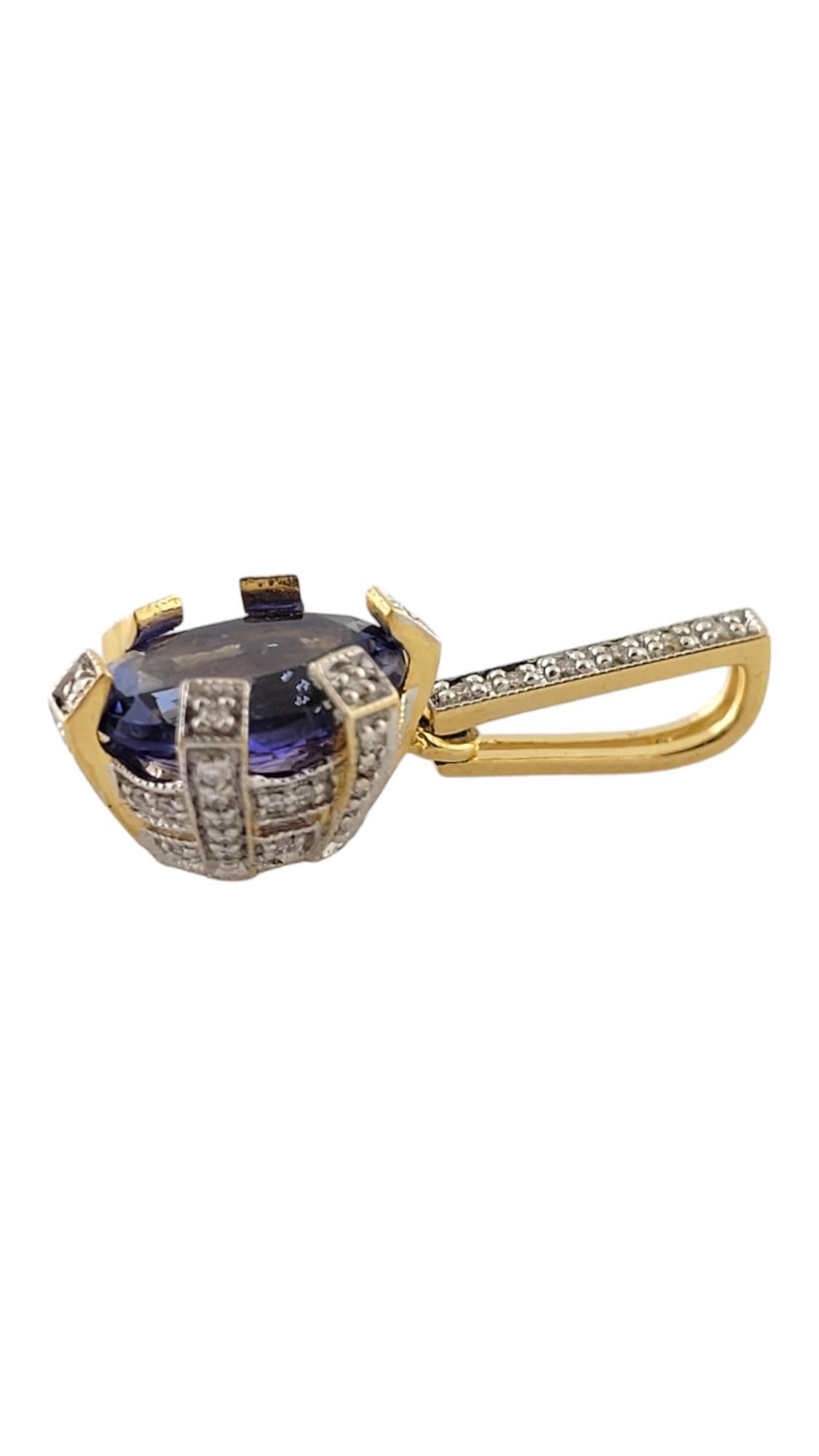 18 Karat Yellow Gold Tanzanite and Diamond Pendant-

This stunning 18K yellow gold pendant features one oval tanzanite (11 mm x 9 mm) and 58 round brilliant cut diamonds set in an elegant basket setting and on bale.

Oval Tanzanite is 2.58 cts.,