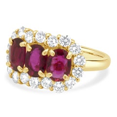 18 Karat Yellow Gold GIA Certified Oval Ruby and Round Diamond Halo Ring