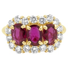 18 Karat Yellow Gold GIA Certified Oval Ruby and Round Diamond Halo Ring