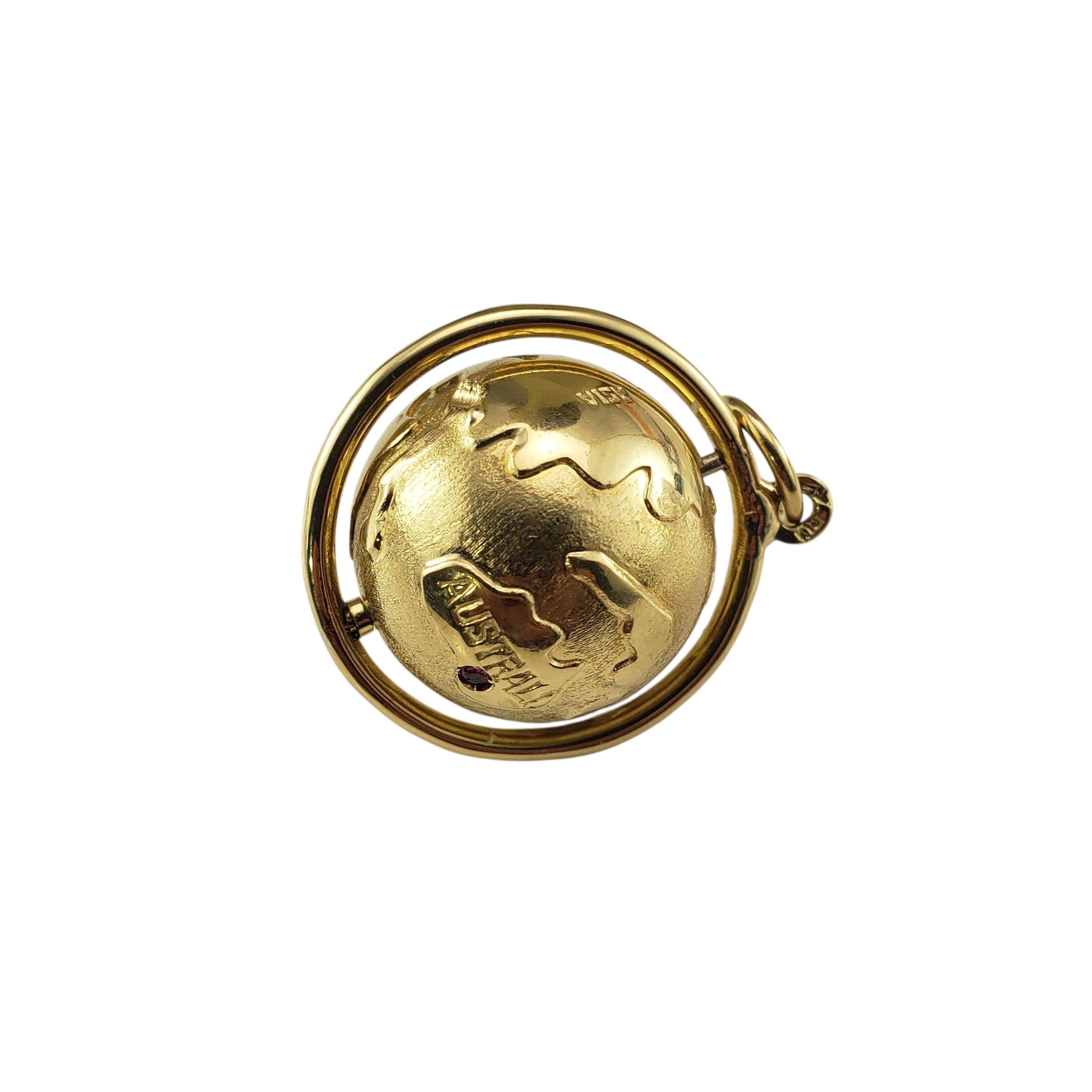 18 Karat Yellow Gold Globe Charm-

Crafted in rich 18K yellow gold, this unique charm features a detailed 3D globe that spins freely within its circular frame. Five vivid red stones accent the piece, adding a striking touch of color and sparkle.