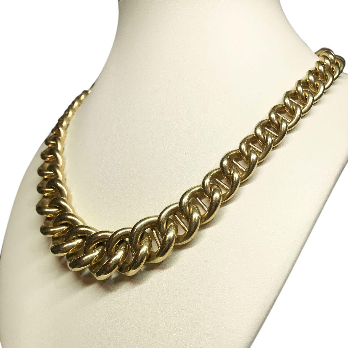 Every jewellery wardrobe should have a wonderful gold curb link chain necklace, a must for every style and every outfit. This one surely fits the bill, with its beautifully crafted links in soft buttery 18k yellow gold that gently graduate from the
