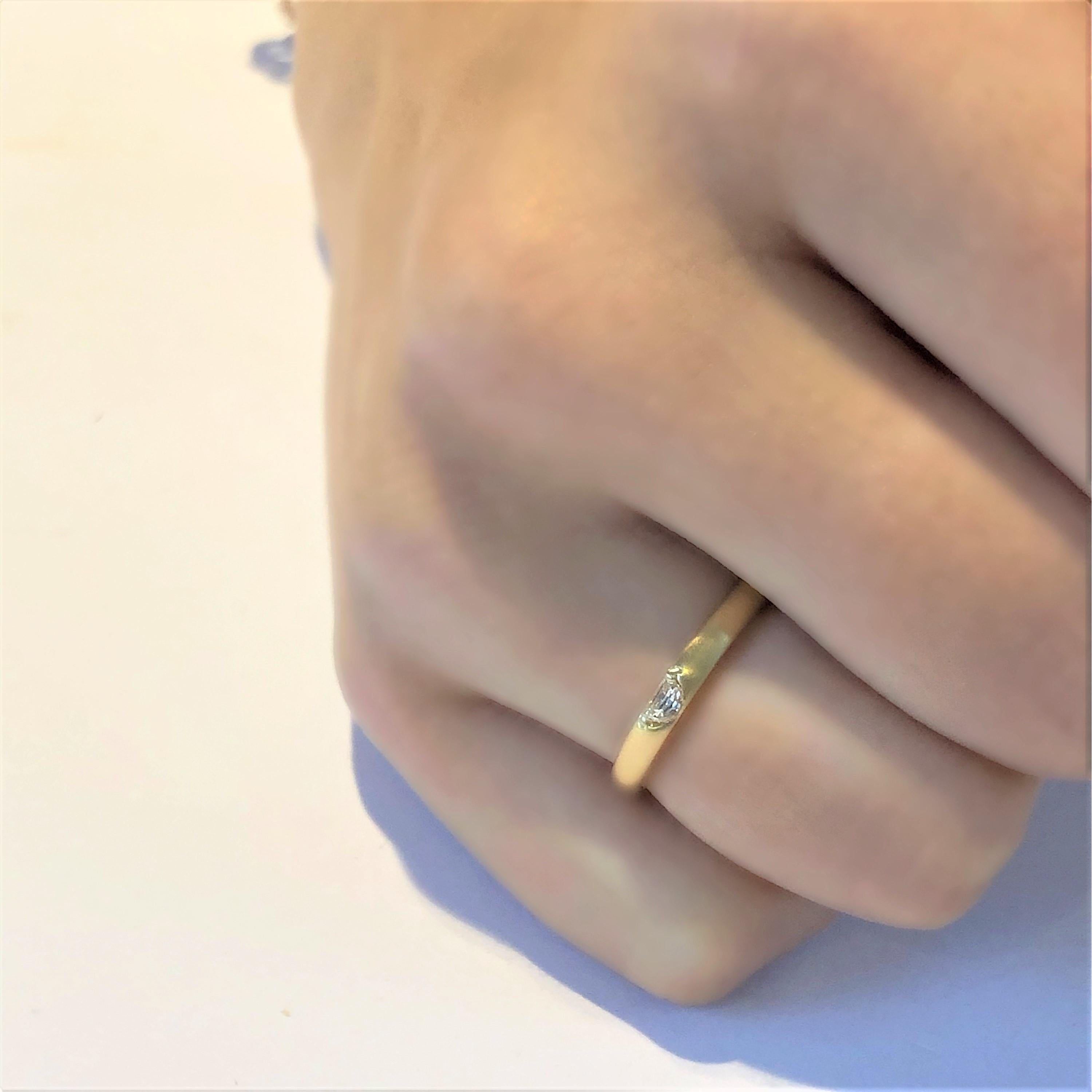 Eighteen karat yellow gold ring
Half Moon Shape diamond weighing 0.17 carat   
Bandwidth 2.5 millimeter    
Semi matt finish                                                               
Ring size 6 In Stock
Ring can be resized
New Ring
Handmade in