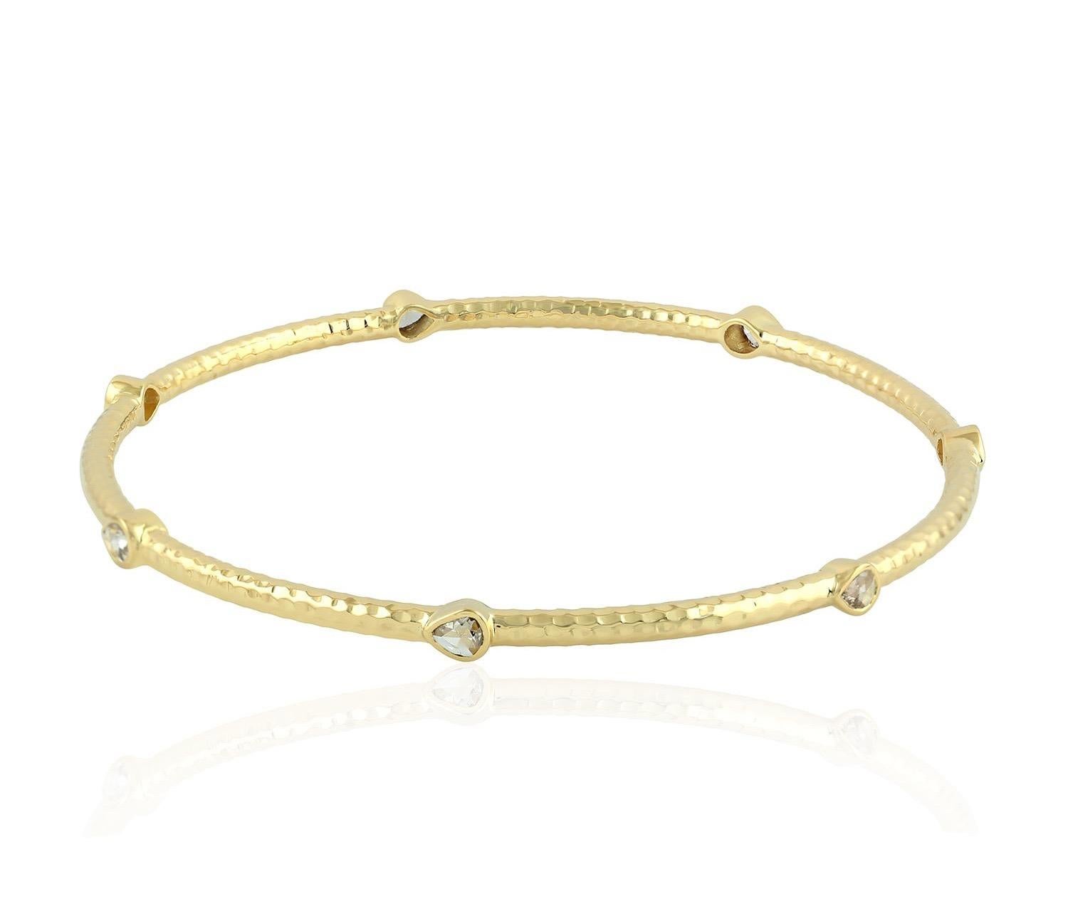 A beautiful bracelet handmade in 18K gold with hammered finish. It is set in .53 carats rosecut diamonds. 

FOLLOW  MEGHNA JEWELS storefront to view the latest collection & exclusive pieces.  Meghna Jewels is proudly rated as a Top Seller on 1stdibs
