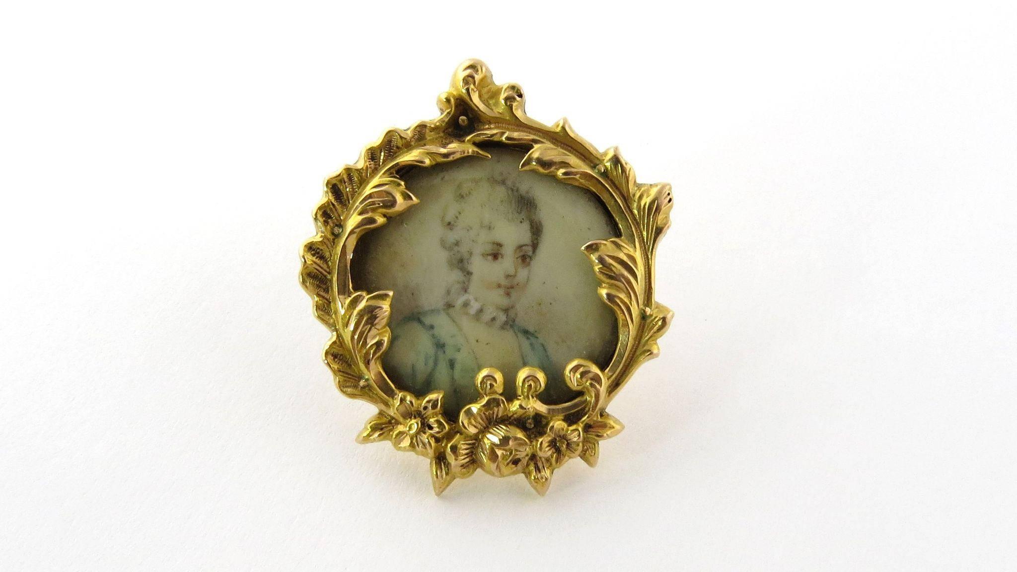 Antique 18K Yellow Gold Hand Painted Victorian Miniature Portrait Brooch Pin. 

Miniature finely detailed hand painted lady's portrait set in a yellow gold wreath. Depicts a lovely lady in a blue dress with white collar, pink lips and brown eyes,