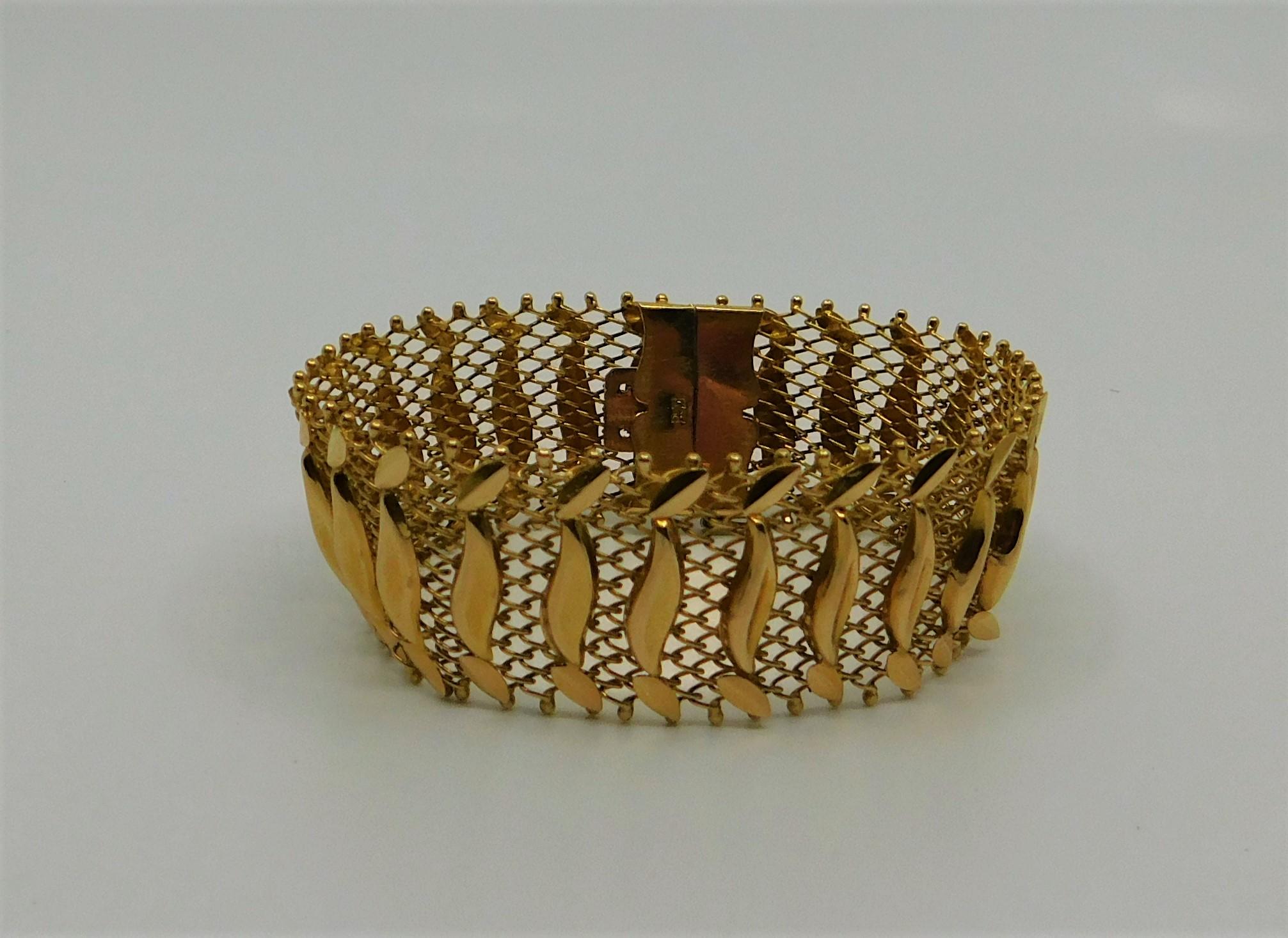 18-karat yellow gold handmade bracelet consisting of gold wire and ball work. Unknown maker mark. Bracelet has a weight of 27 grams.