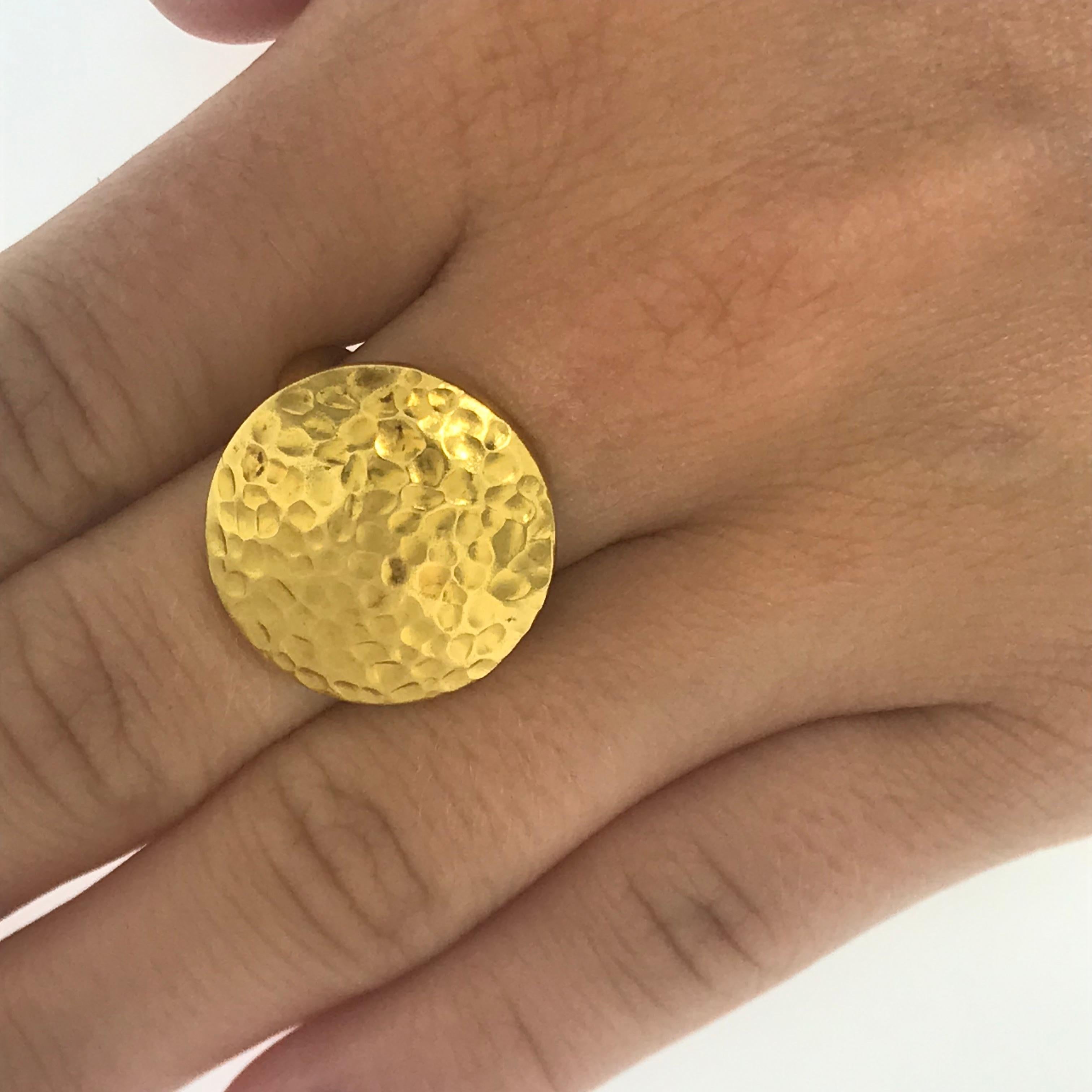 18 Karat Hammered Gold Ring 

This rich 22 karat yellow gold patina ring is bold and beautiful! The handmade hammered detail work is a true art form. This ring is versatile and can be an easy everyday wear or a dramatic piece for a formal event. The
