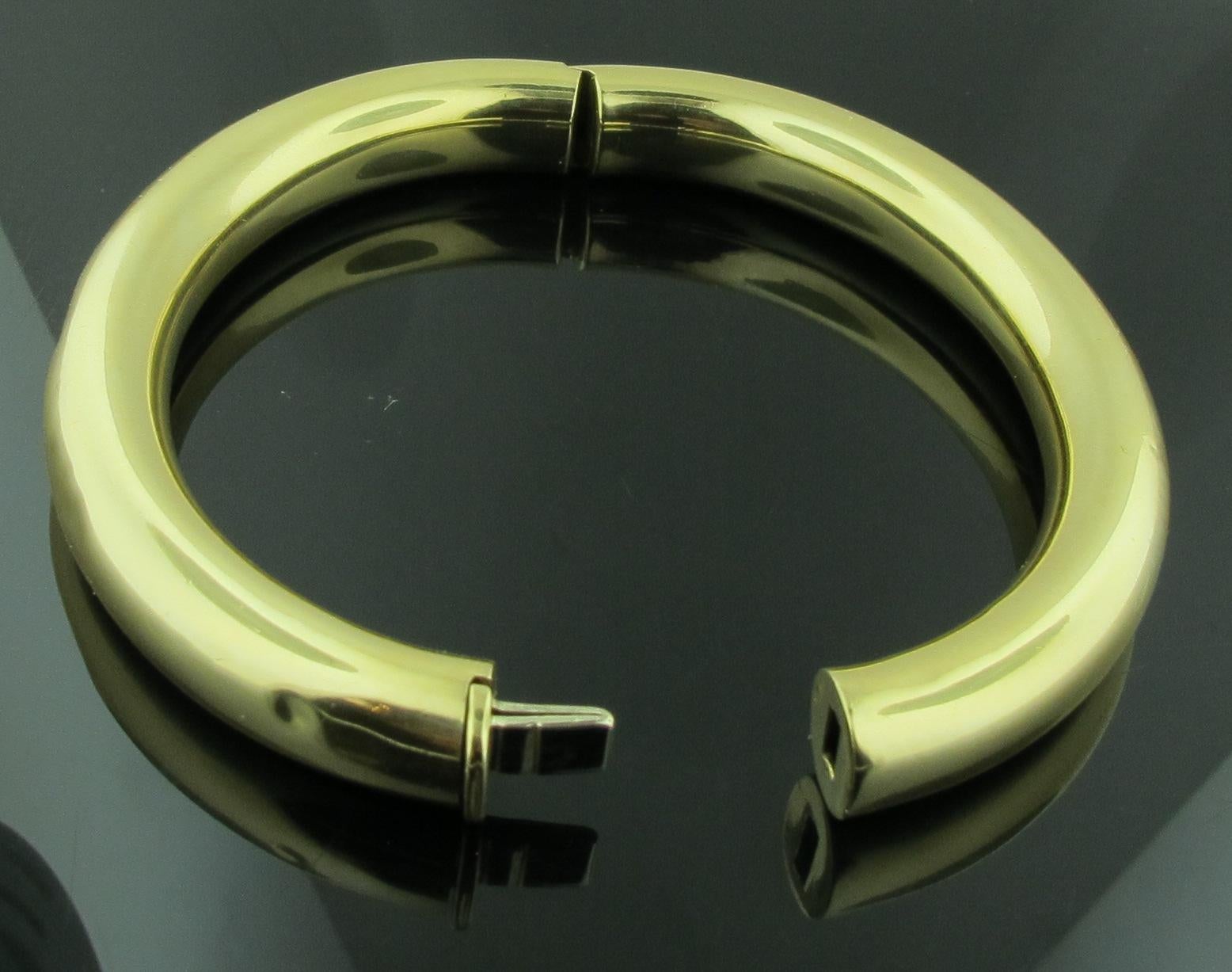 18 karat yellow gold hinged bangle bracelet.  27.6 grams of gold.