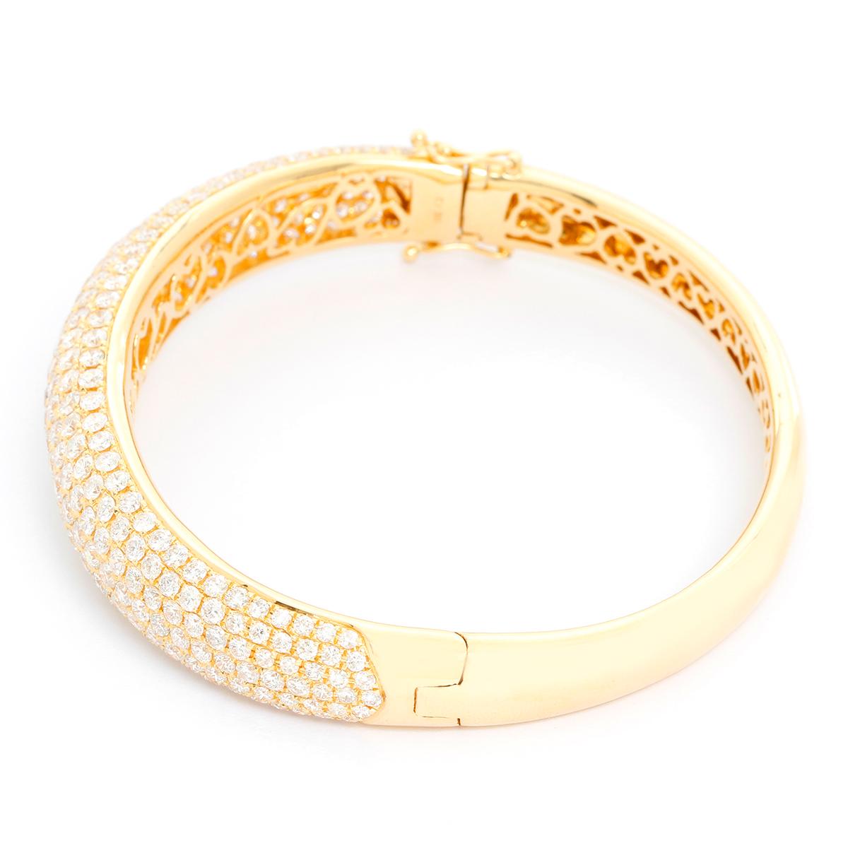 18K Yellow Gold Hinged Diamond Bracelet  - Full cut diamonds weighing 10.6 cts.  set in 18K Yellow gold. Diamond color G-H-I. Diamond Clarity SI. Total weight 35.8 grams. Hallmarks 18K, CJ. Will fit a 6 3/4 inch wrist.