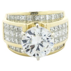 18 Karat Yellow Gold Invisible Set Diamond Ring with CZ Center