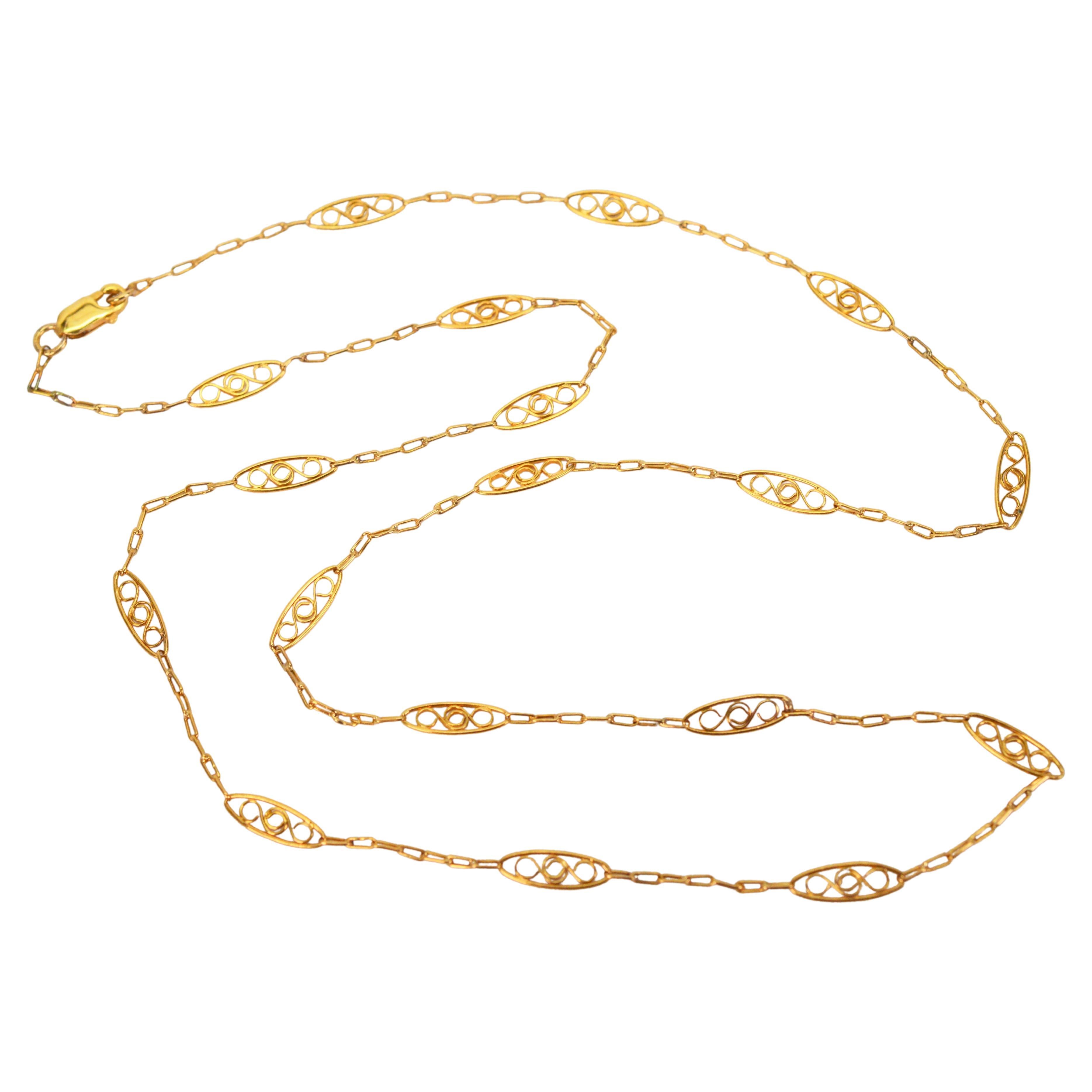 Lovely, Italian made filigree station chain in eighteen karat 18 karat yellow gold.  in a versatile 20 inch length and finished with a lobster clasp.
Gift boxed.