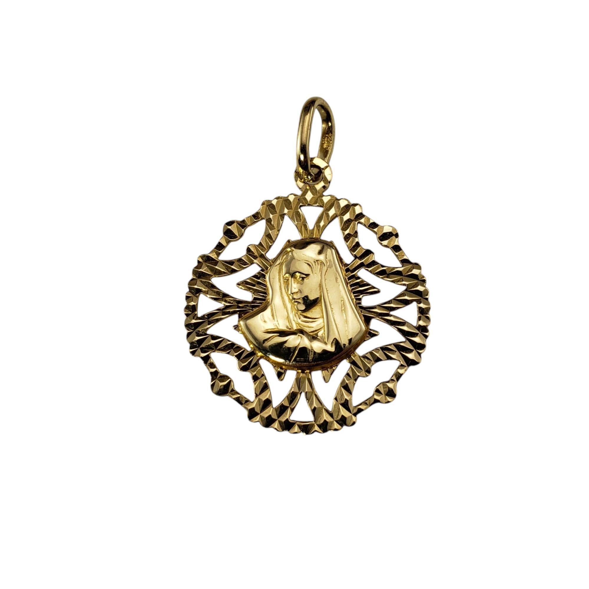 18 Karat Yellow Gold Jesus and Virgin Mary Reversible Pendant

This elegant 18K yellow gold reversible pendant features a stunning dual design, showcasing the sacred images of Jesus Christ on one side and the Virgin Mary on the other. Both
