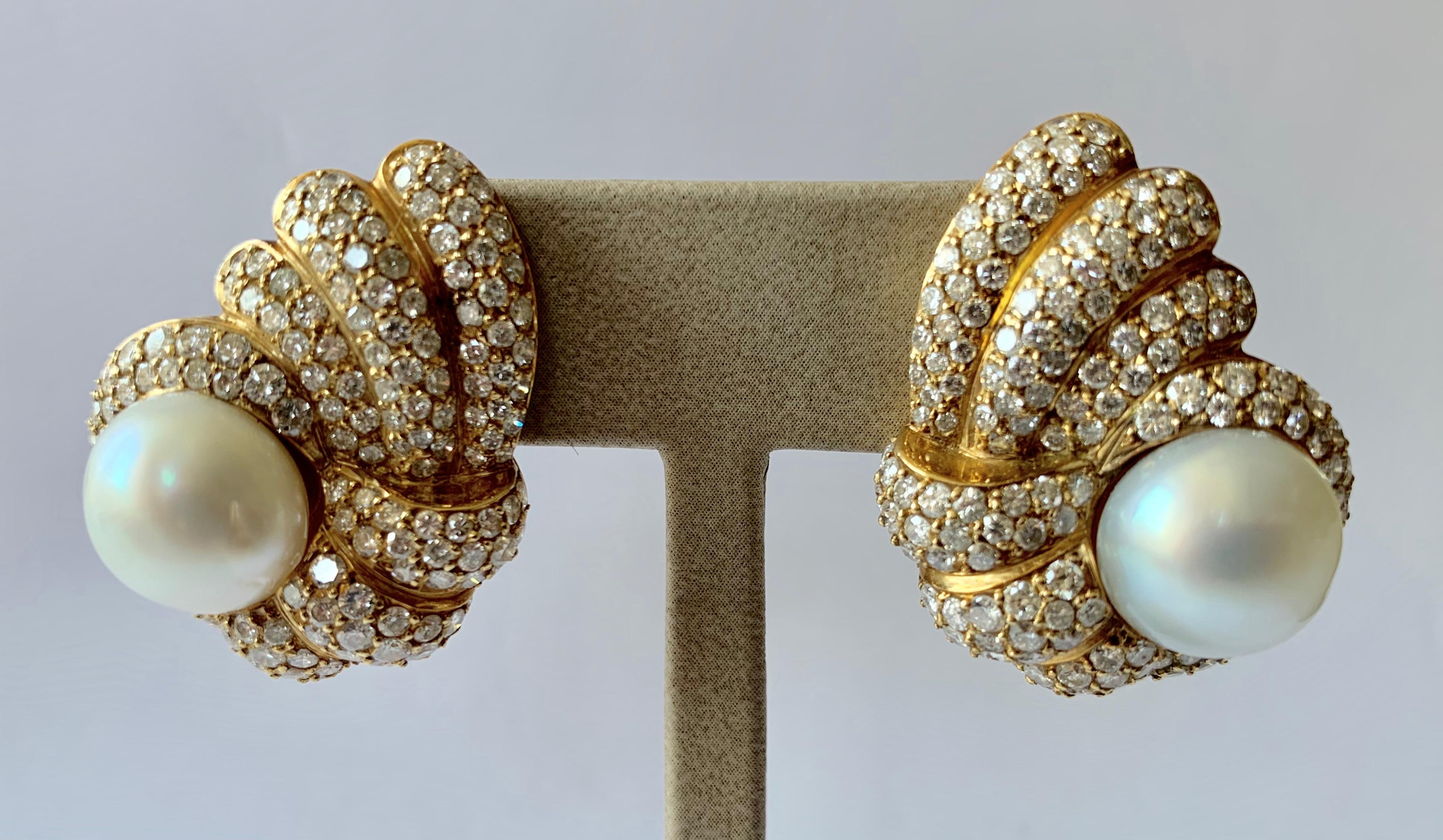 Elegant 18k yellow gold ladies clip-on earrings with south sea pearls and set with a total of 292 brilliant cut diamonds weighing approximately 6.50 ct, G color, vs clarity. 