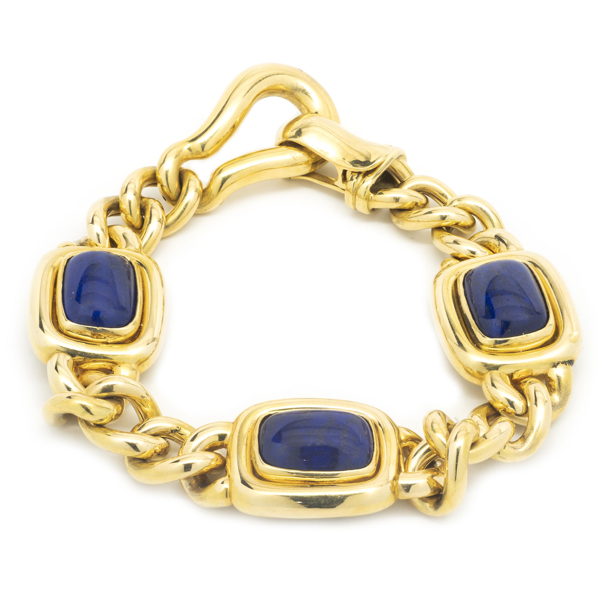 Designer: Gianni Stile
Material: 18k yellow gold
Lapis: 3 stones measuring 9.08mm by 13.23mm each
Dimensions: Link measures 10.31mm in width, settings measure 18.31mm in width
Size: 7
Weight: 33.53 grams
