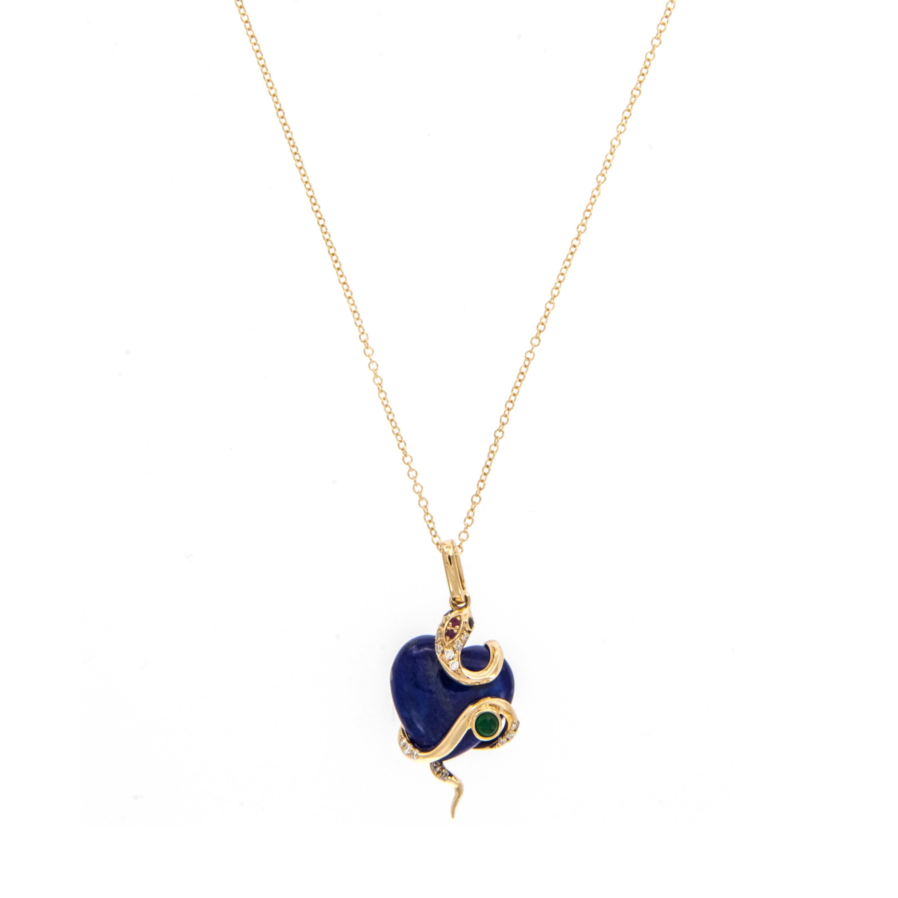 18 karat yellow gold 3.97 Ct lapis heart and serpent necklace with 1 emerald = 0.04 Ct, 2 brown diamond eyes = 0.01 Ct, 2 rubies= 0.01 Ct and 15 diamonds = 0.06 Cttw on a 18