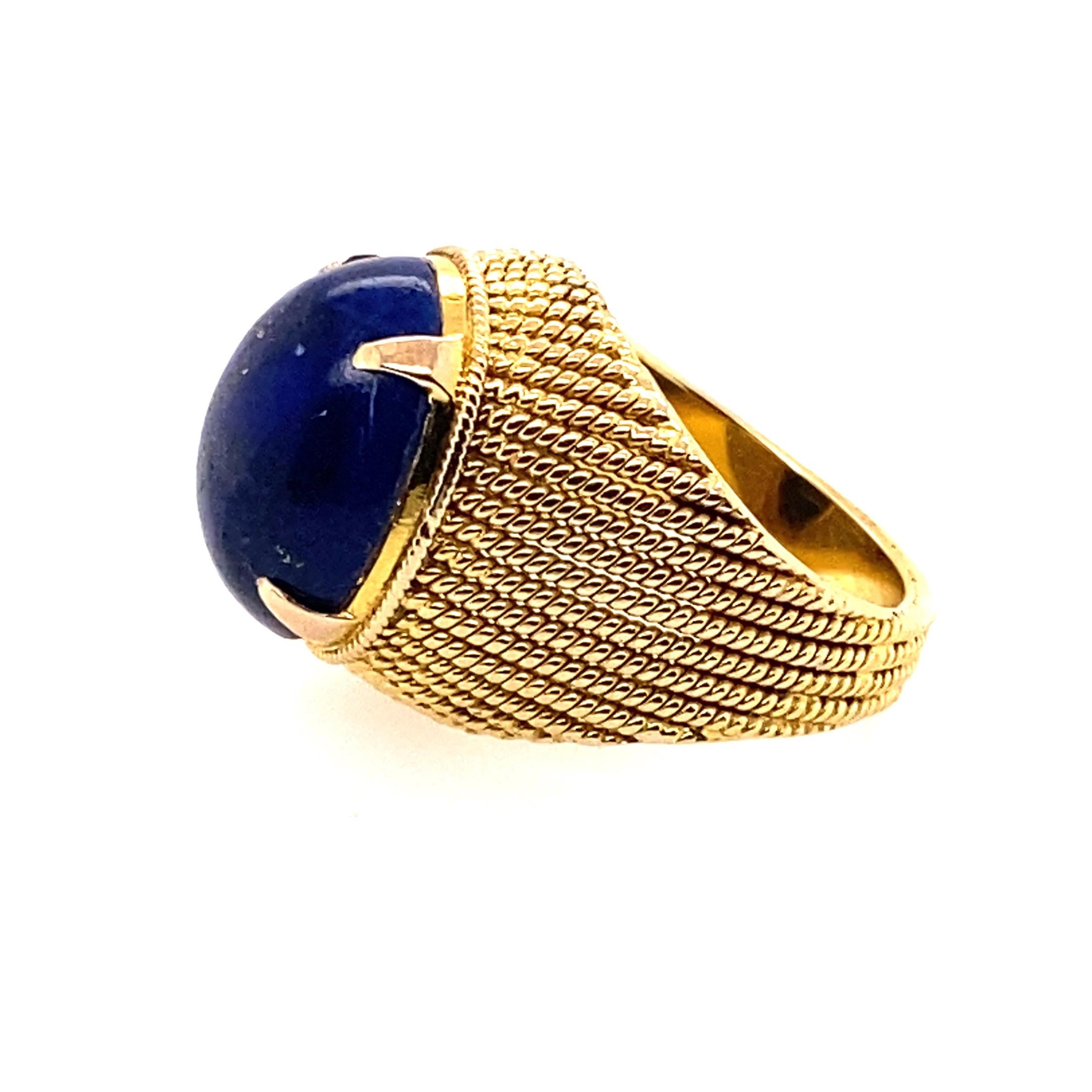 18 Karat Yellow Gold Lapis Lazuli Cocktail Ring

Handmade 18kt yellow gold twisted wire dome ring contain an oval high dome lapis lazuli set in a four claw setting. Lapis lazuli sits 13mm in height above the finger. 

Lapis measurements; 16.18mm x