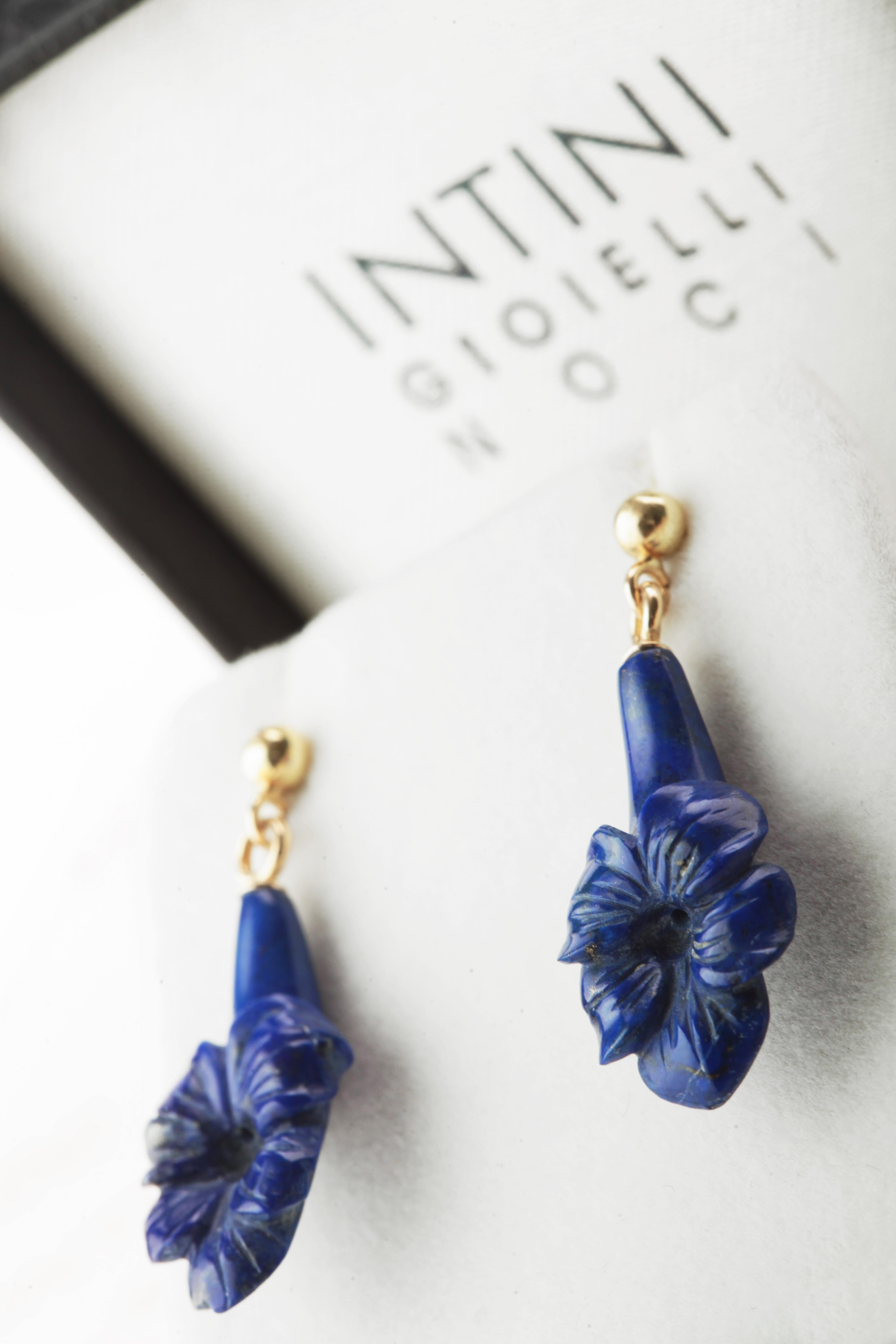 Stunning unique pieces. Lapis Lazuli flower shaped earrings. Marvelous jewel with 18 karat yellow gold setting. Modern, cocktail and chic jewels.

Lapis Lazuli brings the gentle healing power of the sea. It is a stress relieving stone; relaxing,