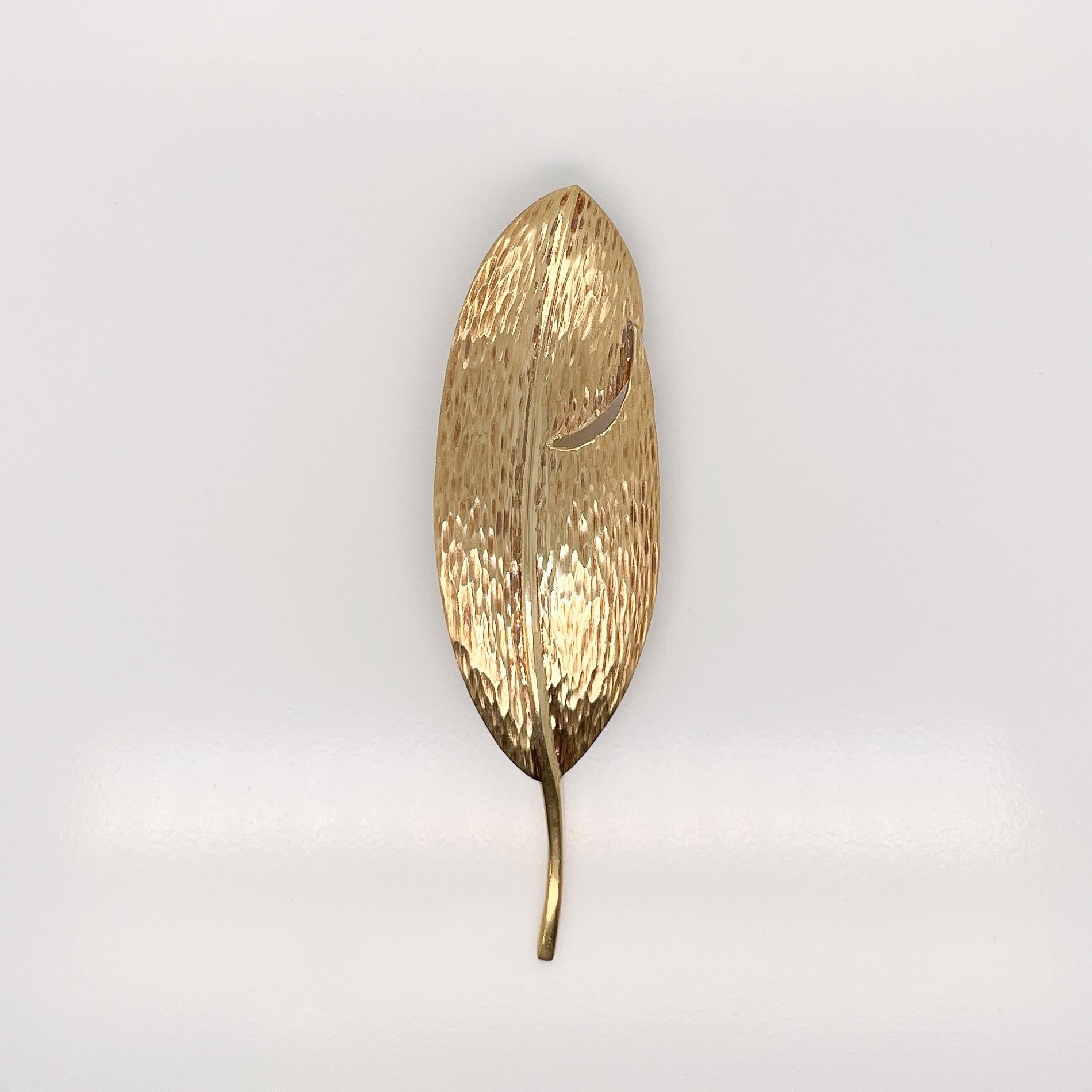 A very fine Tiffany & Co. 18K yellow gold leaf brooch or pin.

By Angela Cummings. 

With a wonderfully textured and hand hammered surface.

Fully hallmarked on the stem.

Simply a terrific brooch by one of Tiffany's best designers!

Date:
20th