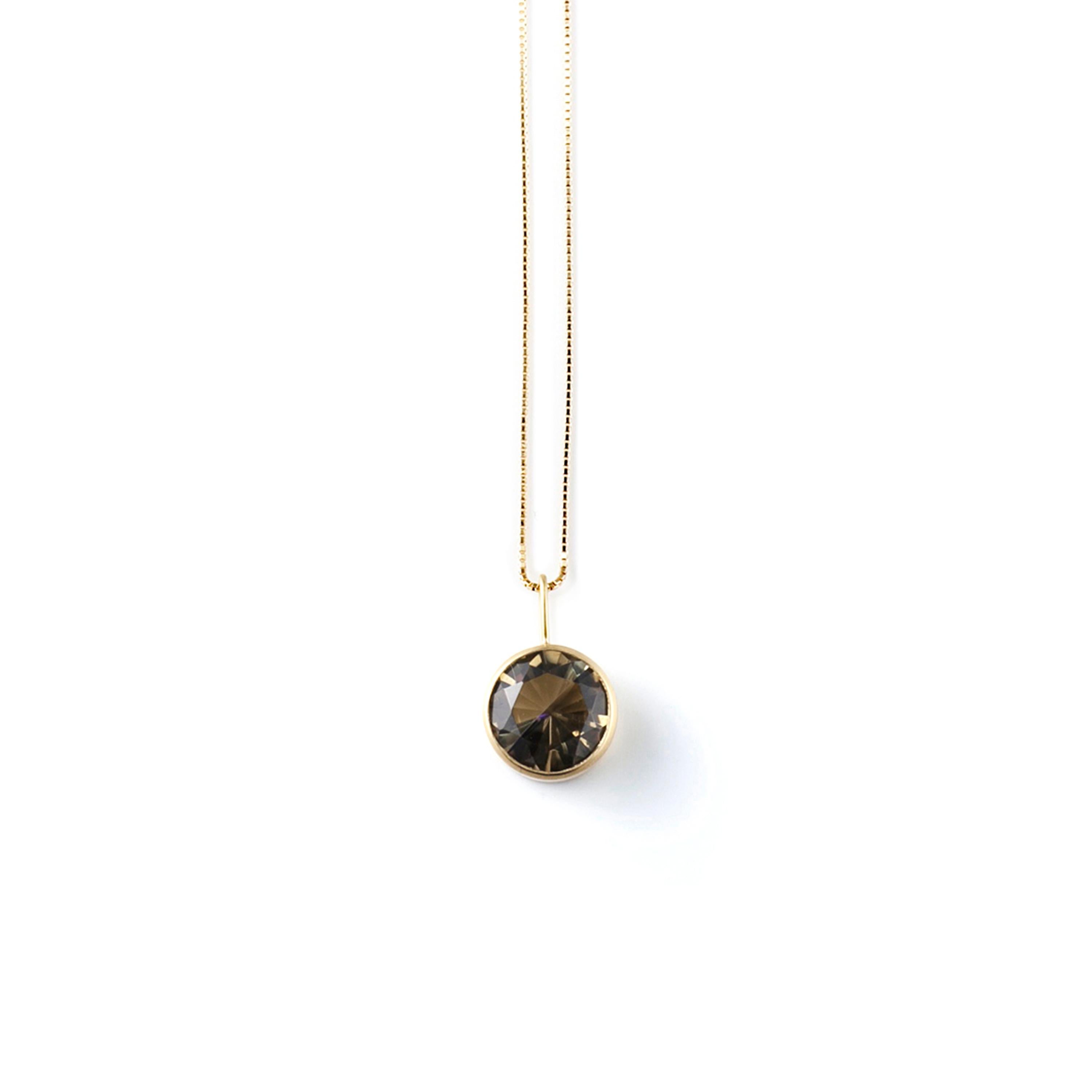 This necklace features a stone that is fashioned from two natural colored stones that have been fused together then cut and polished as one. When the two characteristics of the original gems interact, it forms a unique color and luster that is