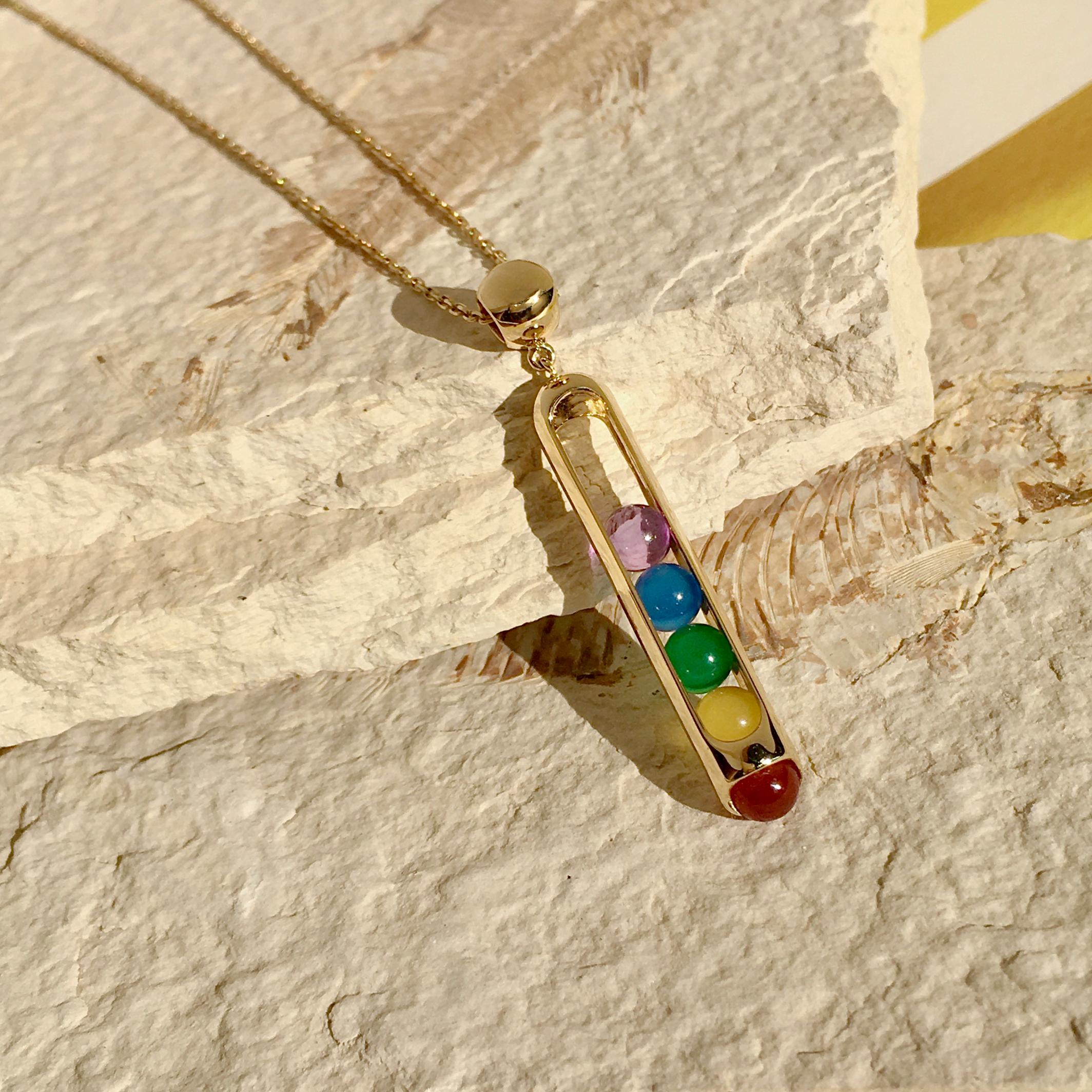 Limited Edition Melody Rainbow Pendant Necklace -a very special talisman for today. This beautifully crafted pendant necklace features a rainbow of playable carnelian, yellow, blue, green chalcedony and amethyst beads set in 18 karat yellow gold on